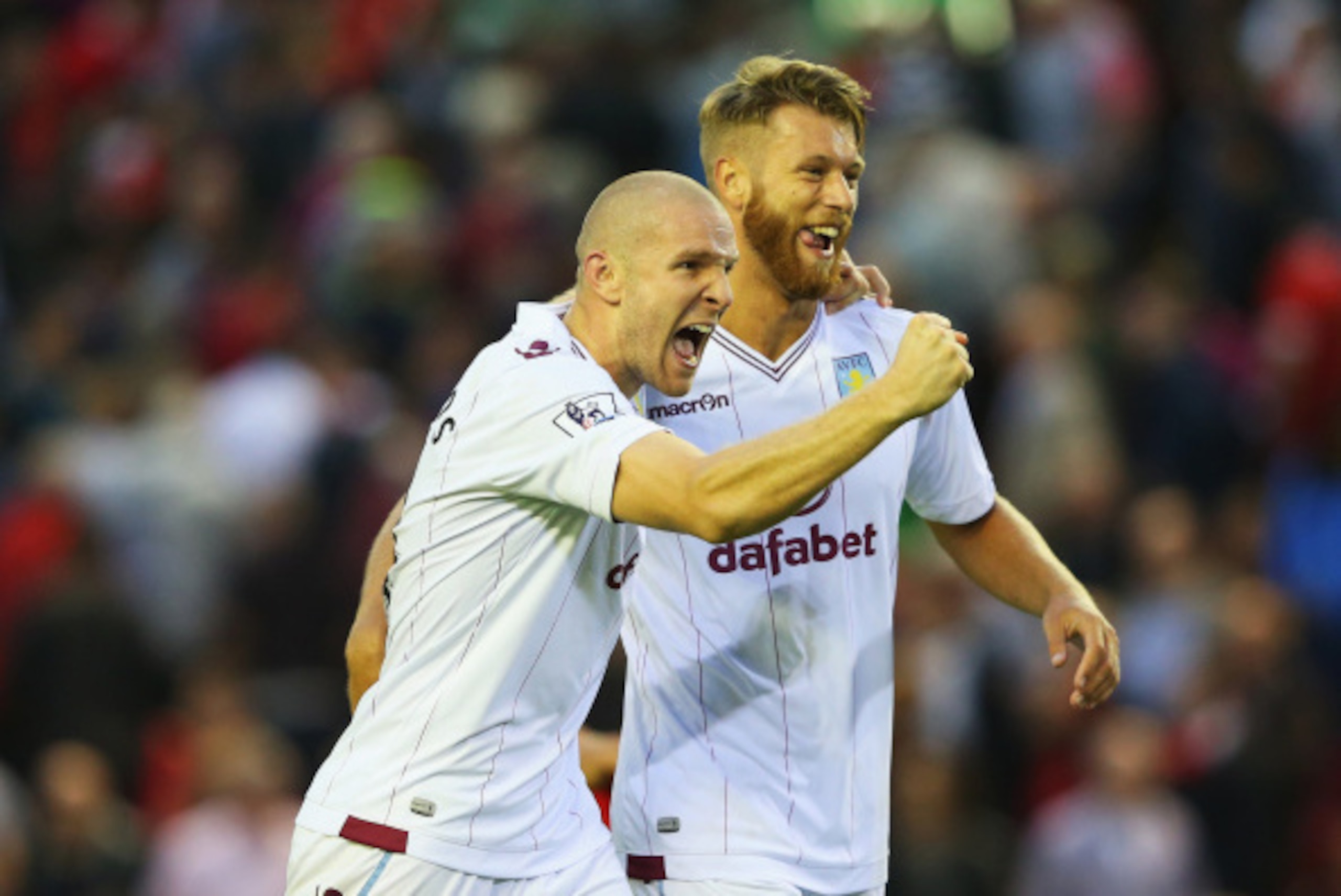 LIVERPOOL, ENGLAND - SEPTEMBER 13:  Philippe Senderos (L) of Aston Villa celebrates victory with Nathan Baker after the Barclays Premier League match between Liverpool and Aston Villa at Anfield on September 13, 2014 in Liverpool, England.  (Photo by Alex