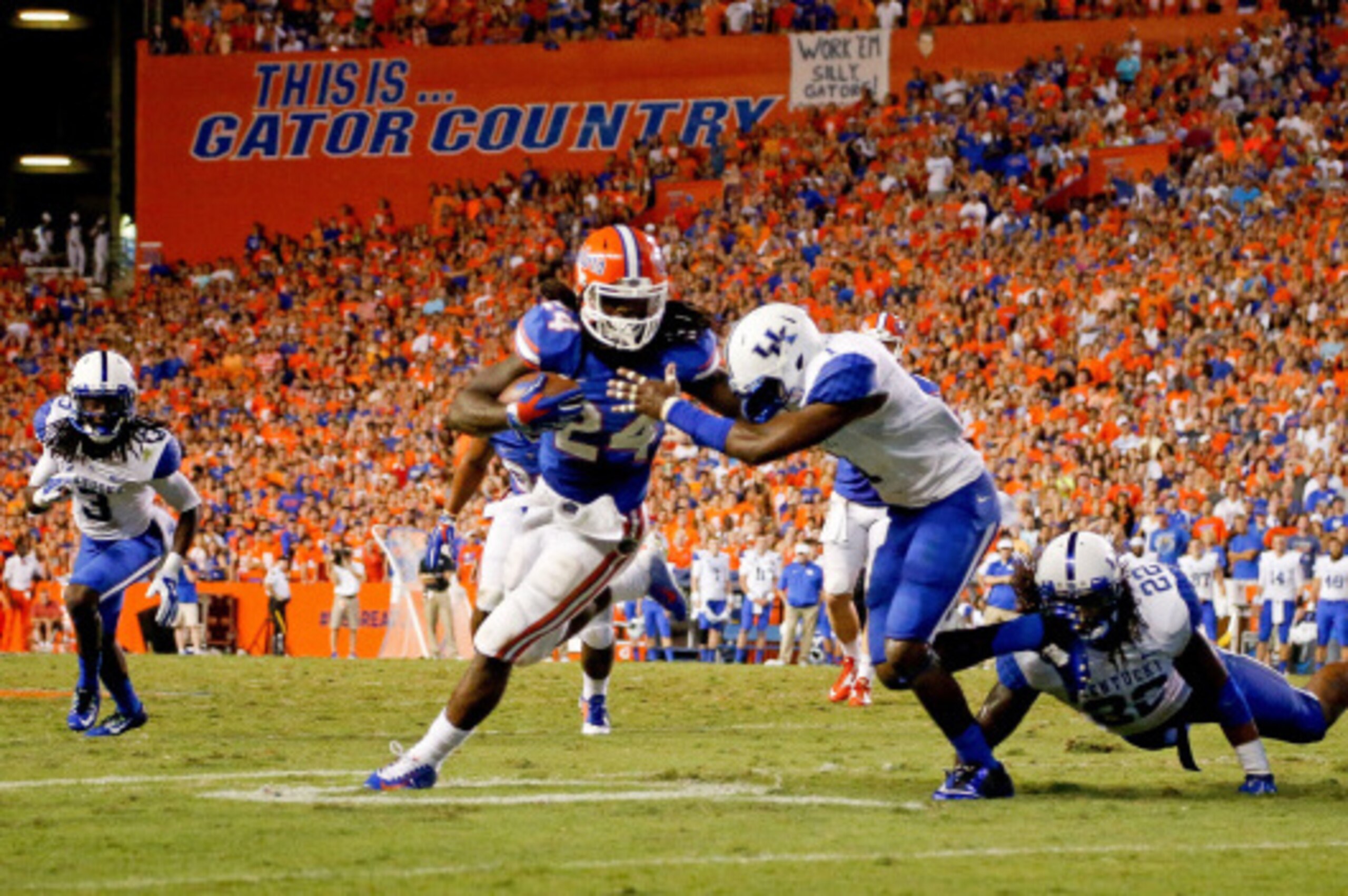 GAINESVILLE, FL - SEPTEMBER 13: Matt Jones #24 of the Florida Gators runs with the ball during the second half of the game against the Kentucky Wildcats at Ben Hill Griffin Stadium on September 13, 2014 in Gainesville, Florida.  (Photo by Rob Foldy/Getty 