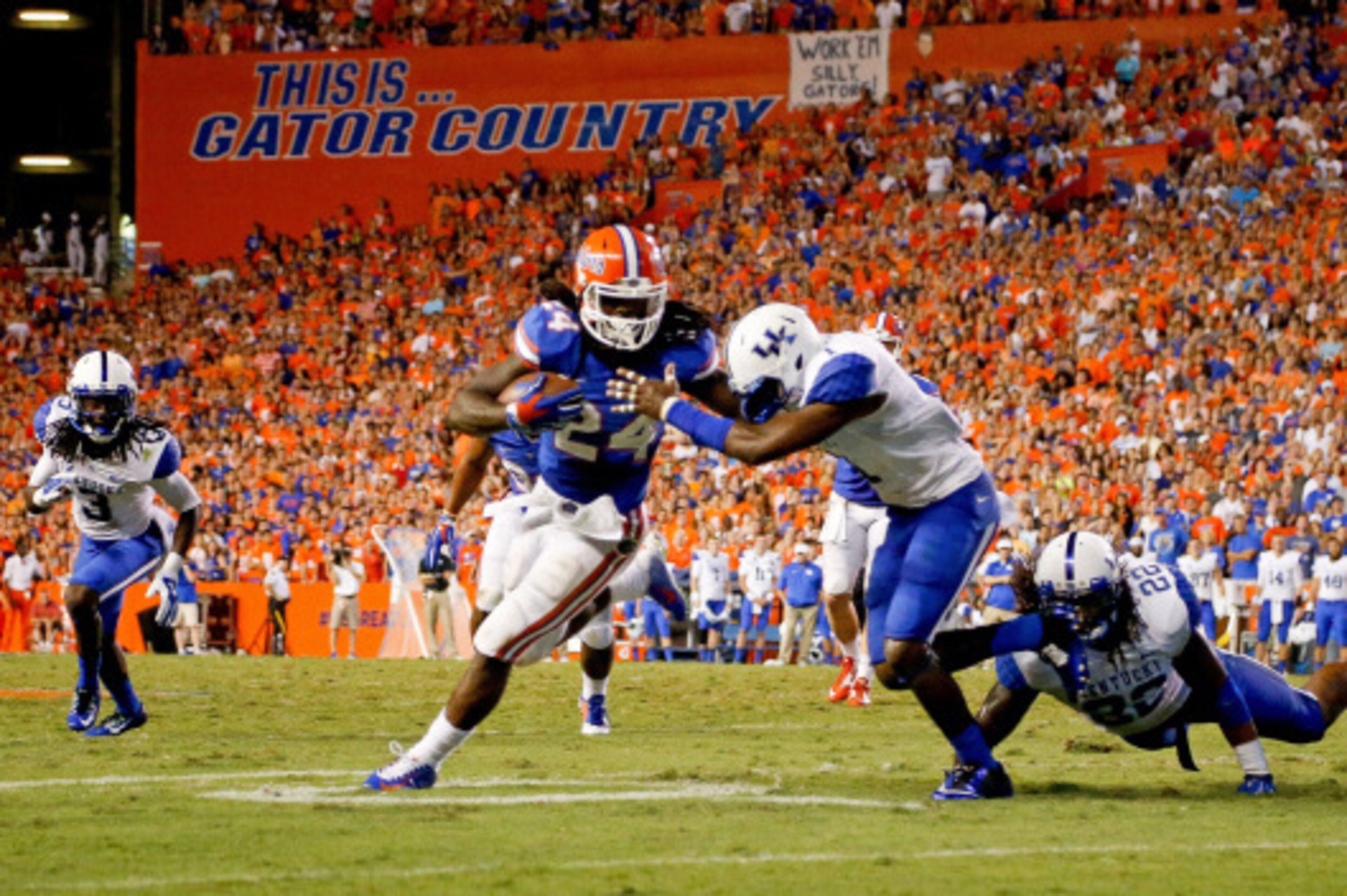 GAINESVILLE, FL - SEPTEMBER 13: Matt Jones #24 of the Florida Gators runs with the ball during the second half of the game against the Kentucky Wildcats at Ben Hill Griffin Stadium on September 13, 2014 in Gainesville, Florida.  (Photo by Rob Foldy/Getty 