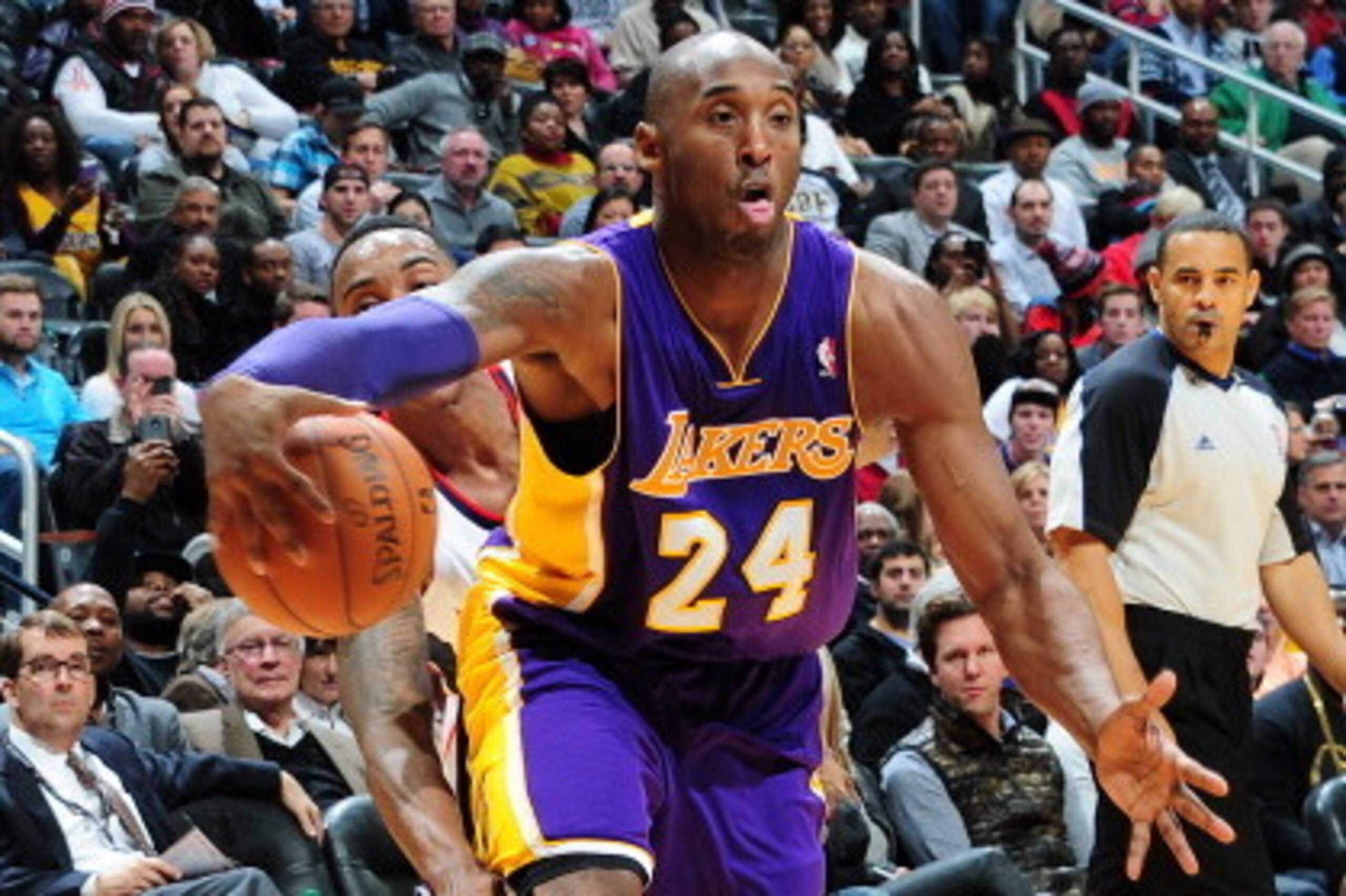 ATLANTA, GA - DECEMBER 16: Kobe Bryant #24 of the Los Angeles Lakers drives to the basket against the Atlanta Hawks on December 16, 2013 at Philips Arena in Atlanta, Georgia.  NOTE TO USER: User expressly acknowledges and agrees that, by downloading and/o