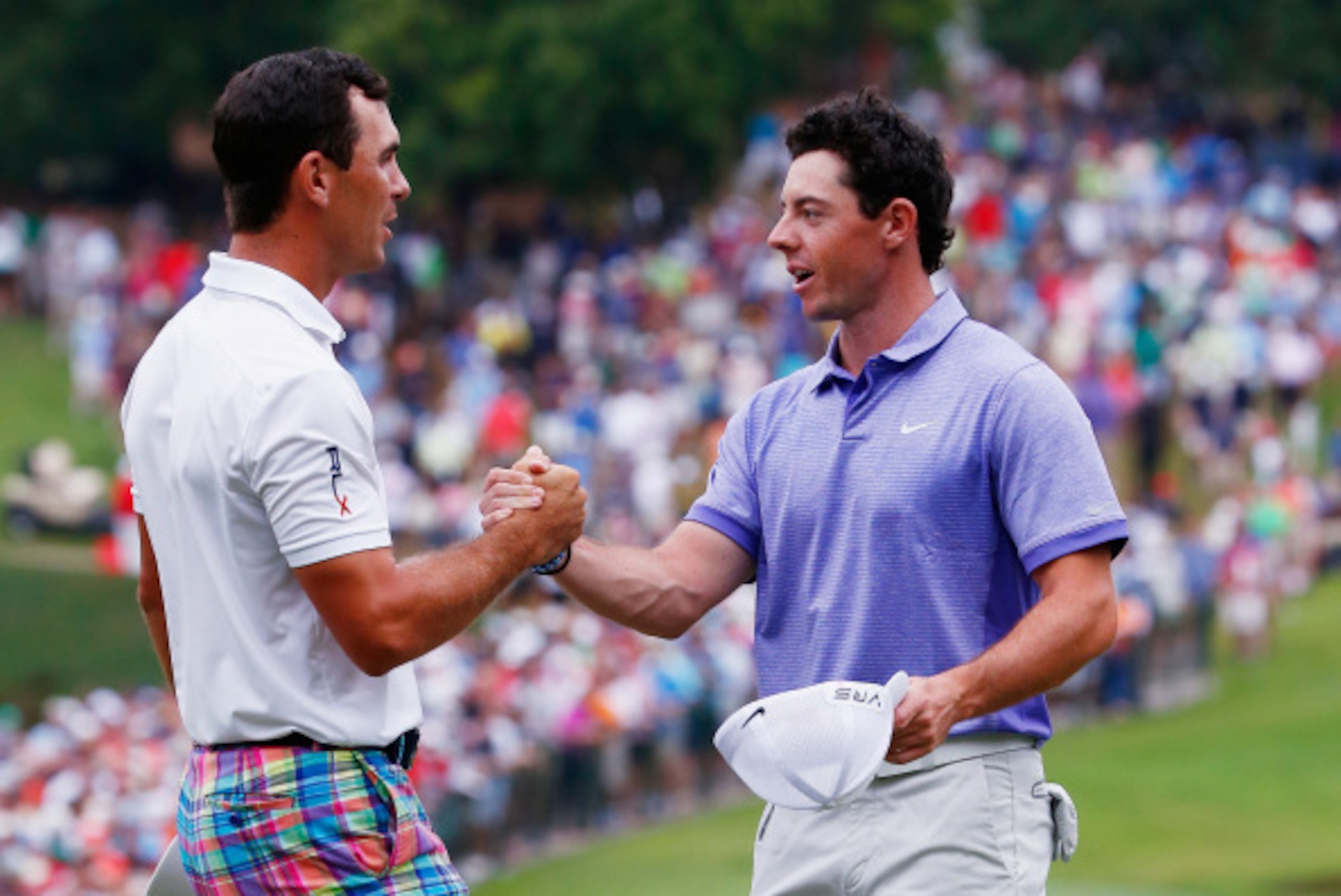 ATLANTA, GA - SEPTEMBER 14:  Billy Horschel of the United States (L) shakes hands with Rory McIlroy of Northern Ireland on the 18th green after Horschel won both the TOUR Championship by Coca-Cola and the FedExCup Playoffs at the East Lake Golf Club on Se