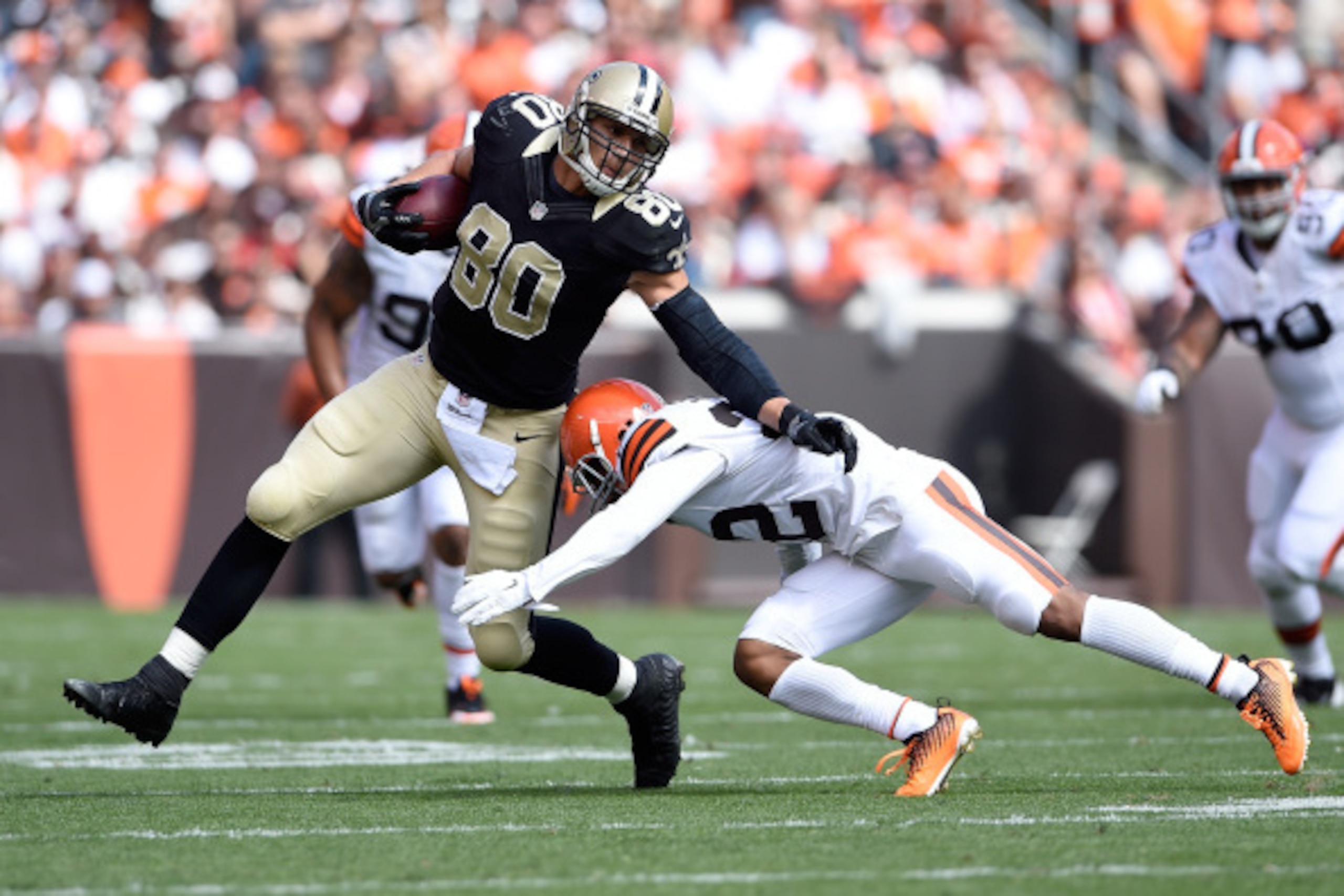 CLEVELAND, OH - SEPTEMBER 14:  Jimmy Graham #80 of the New Orleans Saints avoids a tackle by Buster Skrine #22 of the Cleveland Browns during the second quarter at FirstEnergy Stadium on September 14, 2014 in Cleveland, Ohio.  (Photo by Jason Miller/Getty