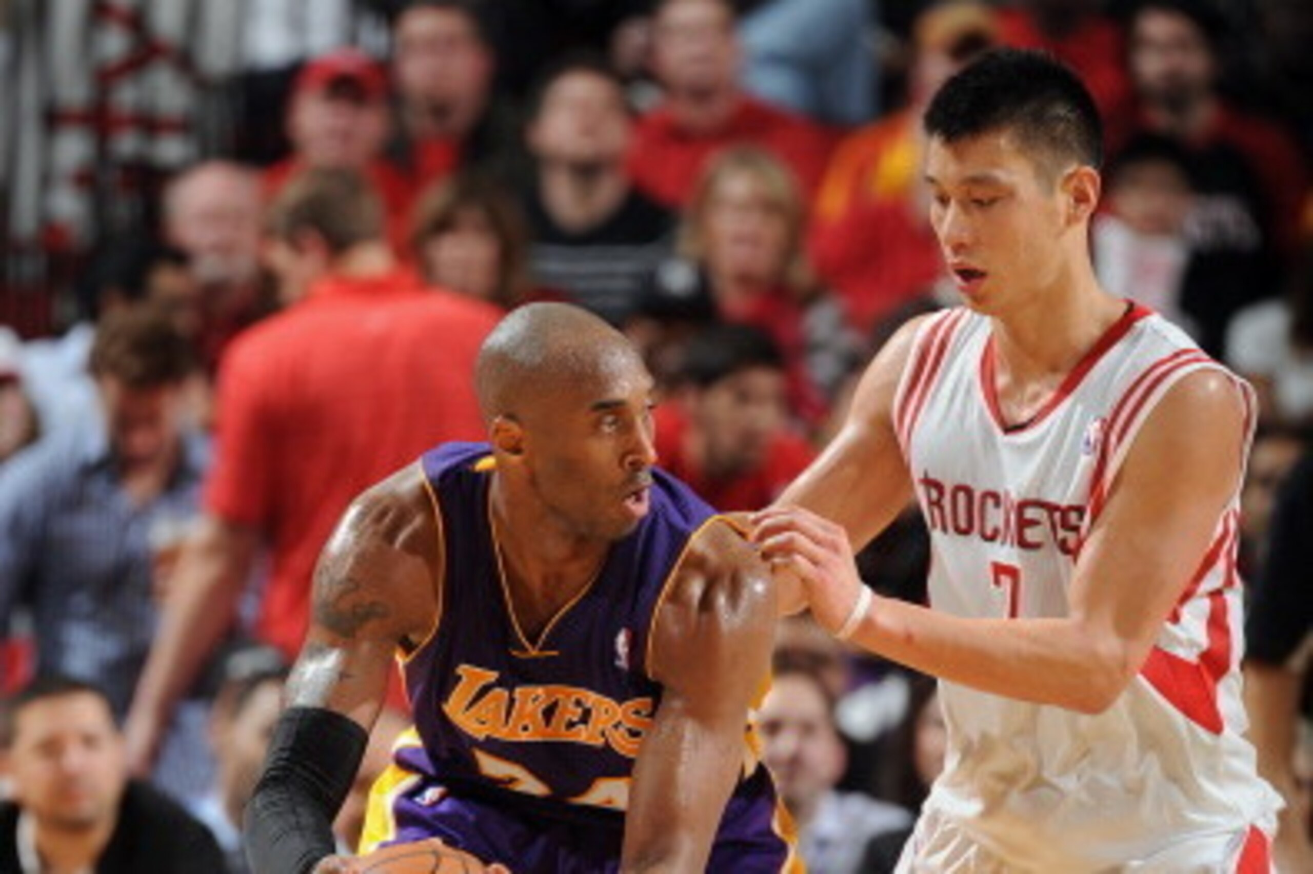 HOUSTON, TX - JANUARY 8: Kobe Bryant #24 of the Los Angeles Lakers controls the ball against Jeremy Lin #7 of the Houston Rockets on January 8, 2013 at the Toyota Center in Houston, Texas. NOTE TO USER: User expressly acknowledges and agrees that, by down
