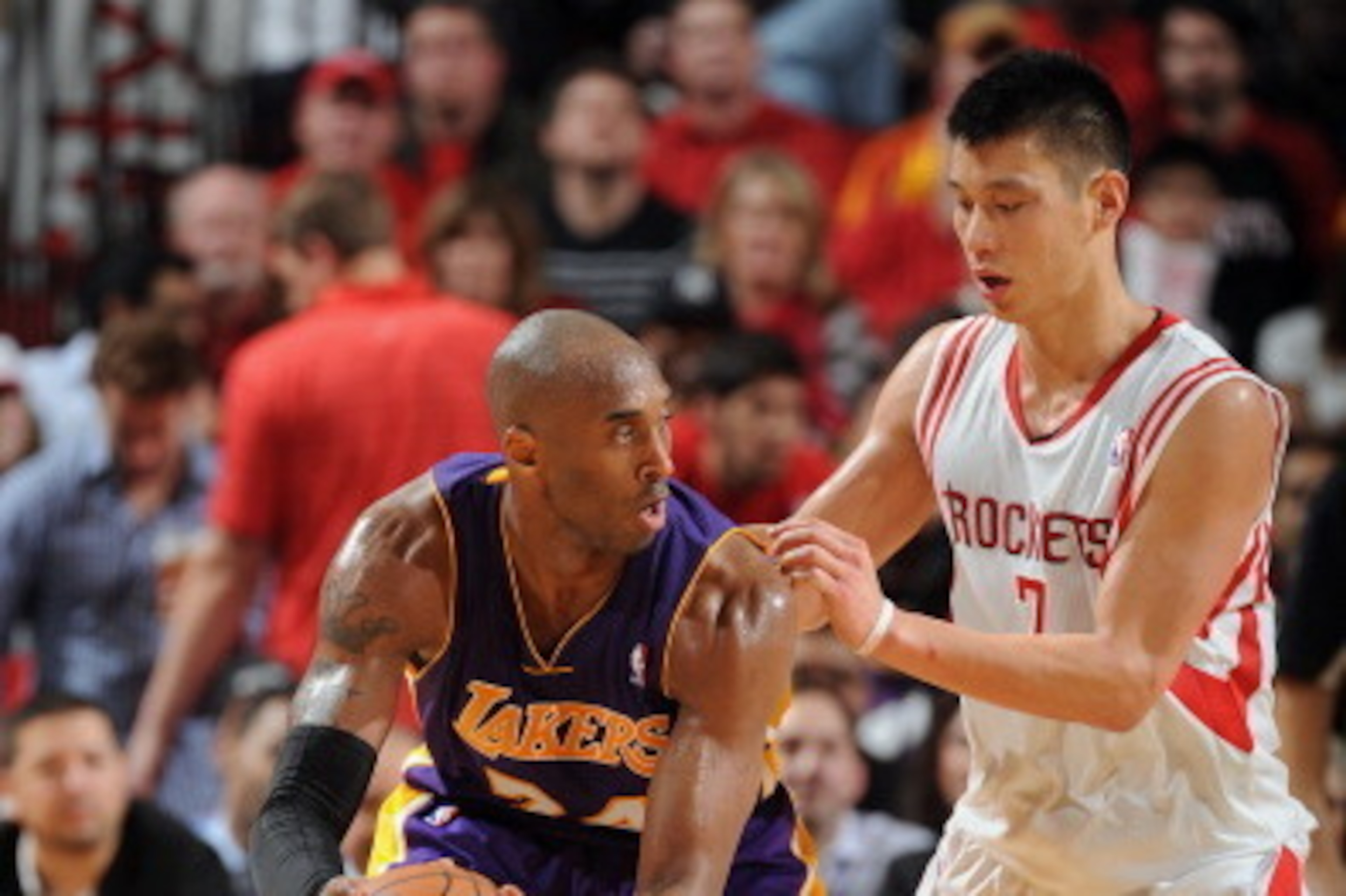 HOUSTON, TX - JANUARY 8: Kobe Bryant #24 of the Los Angeles Lakers controls the ball against Jeremy Lin #7 of the Houston Rockets on January 8, 2013 at the Toyota Center in Houston, Texas. NOTE TO USER: User expressly acknowledges and agrees that, by down