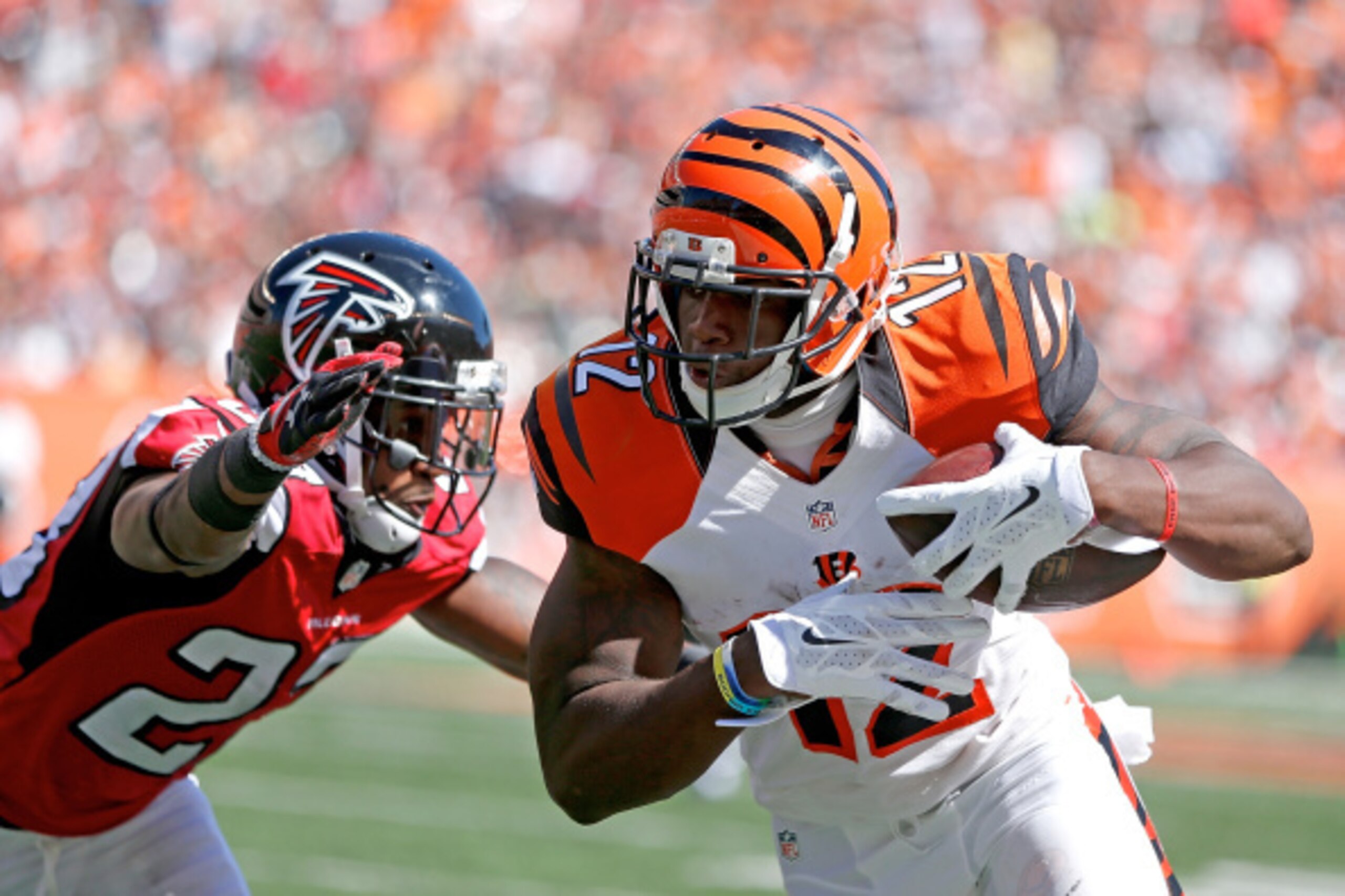 CINCINNATI, OH - SEPTEMBER 14:  Robert McClain #27 of the Atlanta Falcons attempts to tackle Mohamed Sanu #12 of the Cincinnati Bengals during the third quarter at Paul Brown Stadium on September 14, 2014 in Cincinnati, Ohio. (Photo by Joe Robbins/Getty I