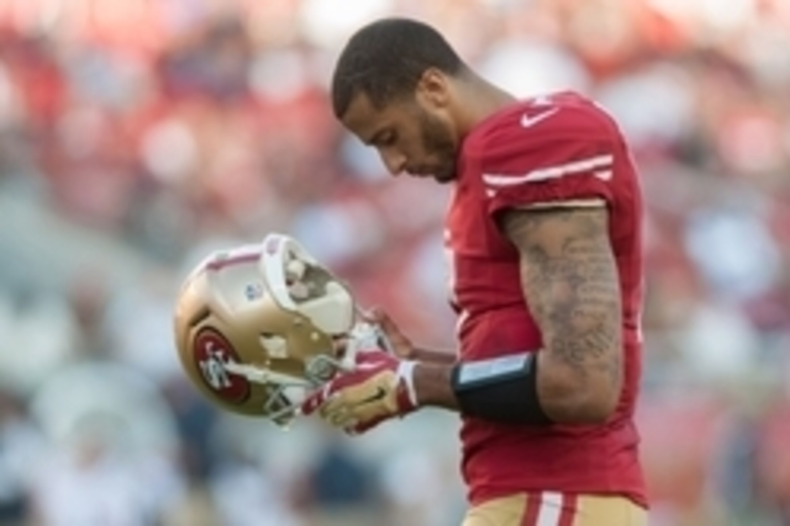 Sep 14, 2014; Santa Clara, CA, USA; San Francisco 49ers quarterback Colin Kaepernick (7) looks on during the second quarter of the game against the Chicago Bears at Levi's Stadium. The Chicago Bears defeated the San Francisco 49ers 28-20. Mandatory Credit