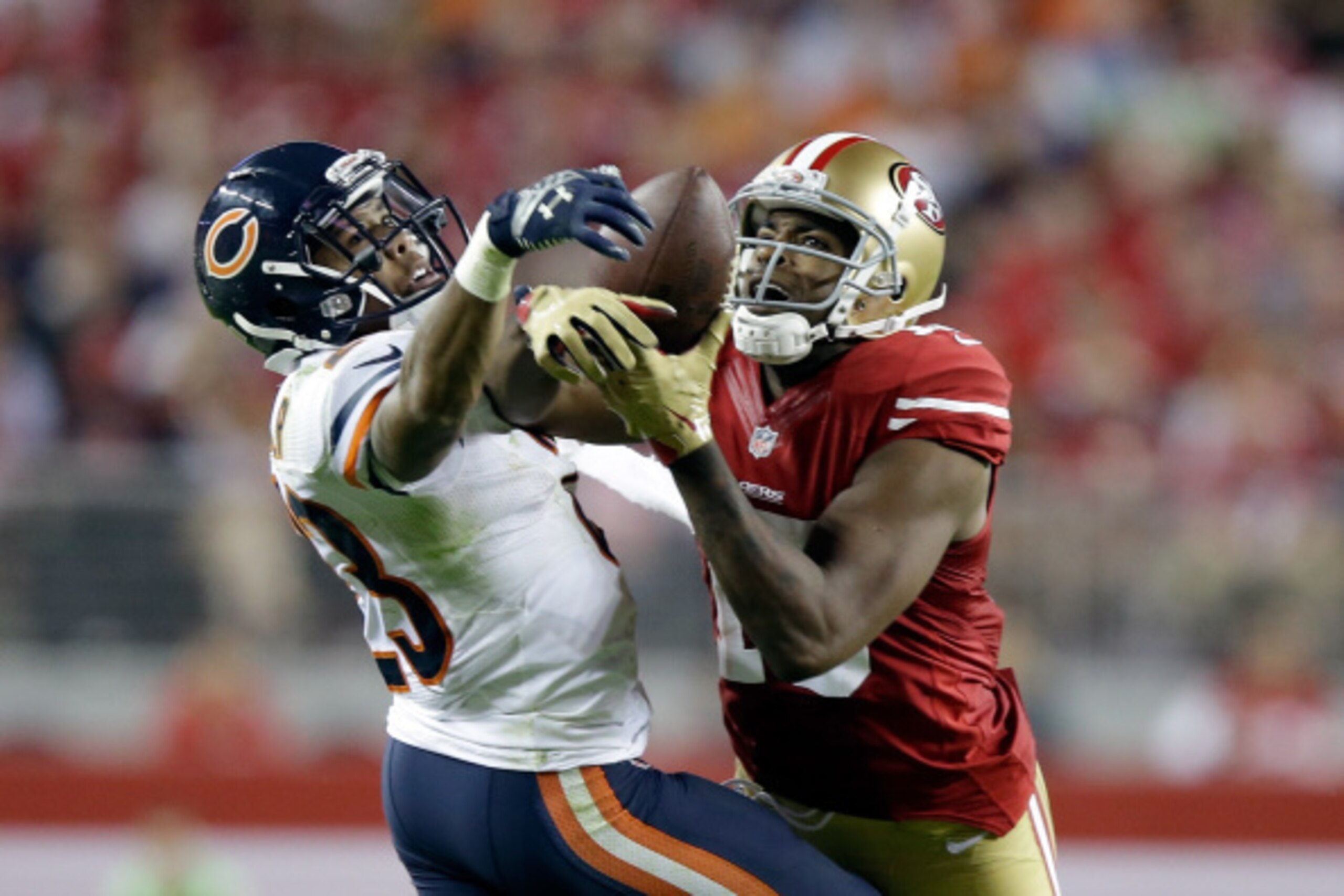 SANTA CLARA, CA - SEPTEMBER 14:  Cornerback Kyle Fuller #23 of the Chicago Bears intercepts a pass intended for wide receiver Michael Crabtree #15 of the San Francisco 49ers at Levi's Stadium on September 14, 2014 in Santa Clara, California.  (Photo by Ez