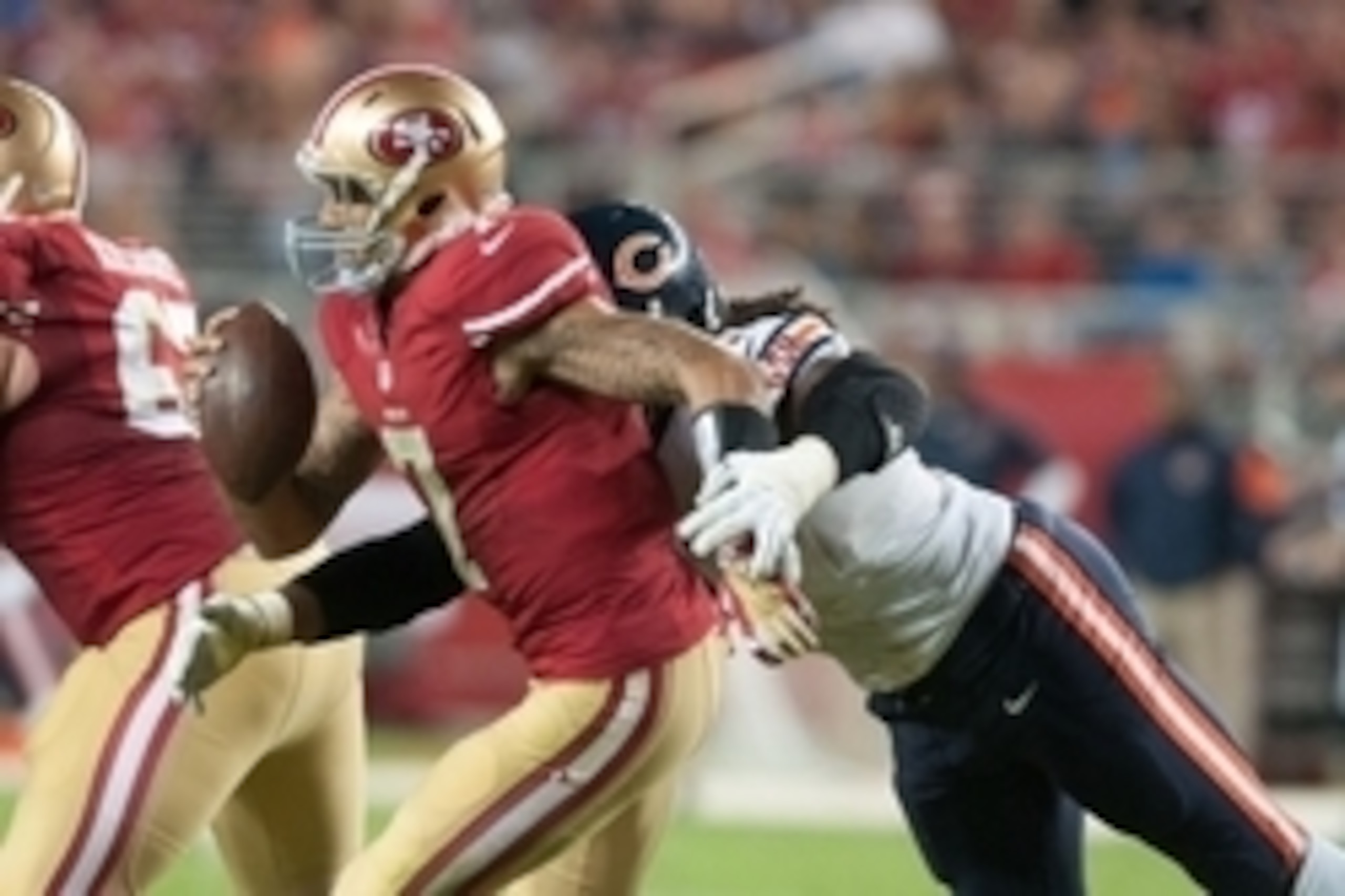 Sep 14, 2014; Santa Clara, CA, USA; San Francisco 49ers quarterback Colin Kaepernick (7) is sacked by Chicago Bears defensive end Willie Young (97) during the fourth quarter at Levi's Stadium. The Chicago Bears defeated the San Francisco 49ers 28-20. Mand