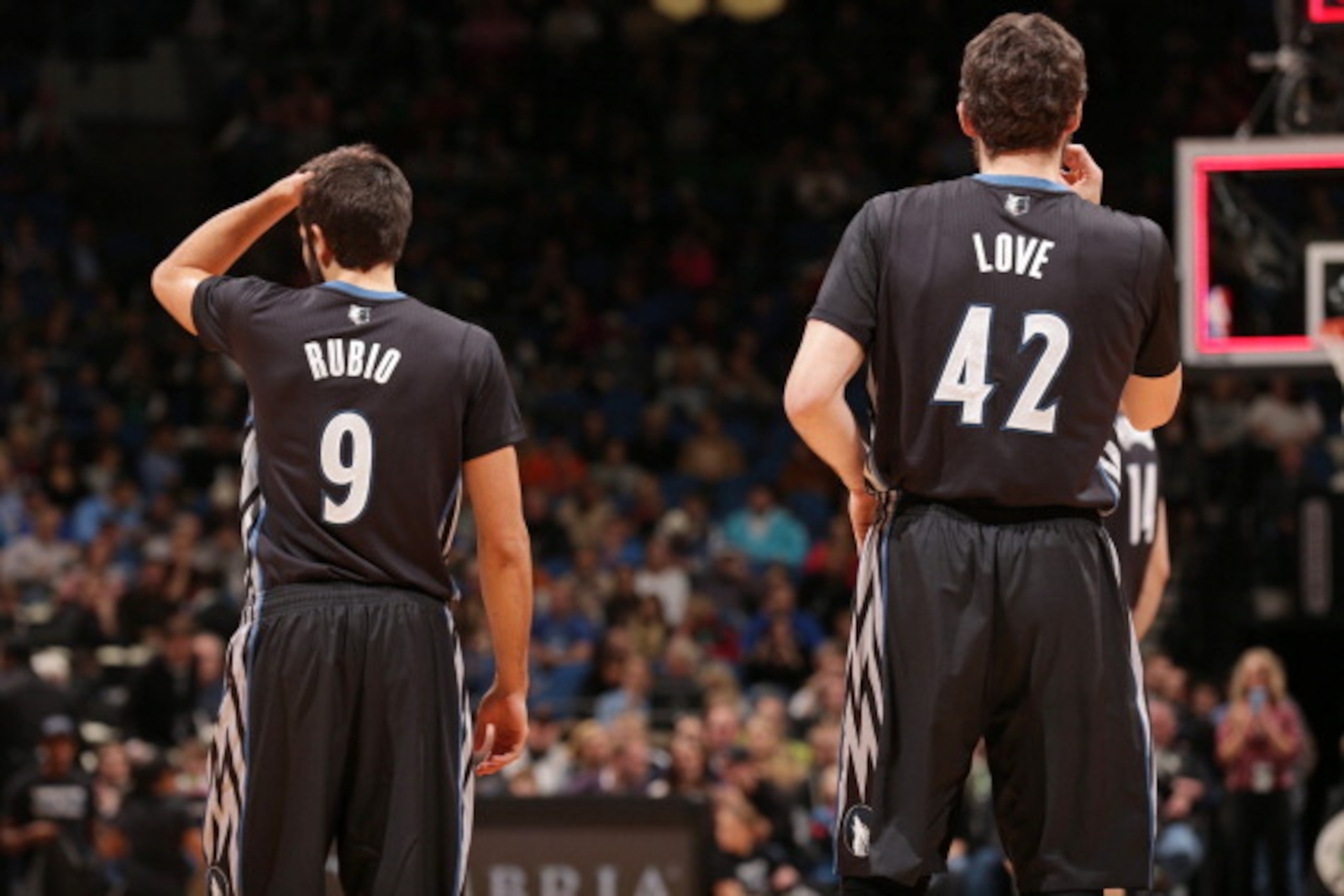 MINNEAPOLIS, MN - NOVEMBER 27:  Ricky Rubio #9 and Kevin Love #42 of the Minnesota Timberwolves stand on the court against the Denver Nuggets on November 27, 2013 at Target Center in Minneapolis, Minnesota. NOTE TO USER: User expressly acknowledges and ag