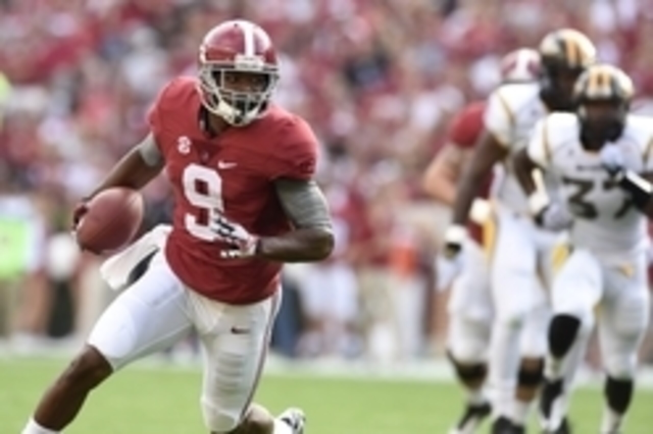 Sep 13, 2014; Tuscaloosa, AL, USA; Alabama Crimson Tide wide receiver Amari Cooper (9) carries for a touchdown against the Southern Miss Golden Eagles during the first quarter at Bryant-Denny Stadium. Mandatory Credit: John David Mercer-USA TODAY Sports Sep 13, 2014; Tuscaloosa, AL, USA; Alabama Crimson Tide wide receiver Amari Cooper (9) carries for a touchdown against the Southern Miss Golden Eagles during the first quarter at Bryant-Denny Stadium. Mandatory Credit: John David Mercer-USA TODAY Sports