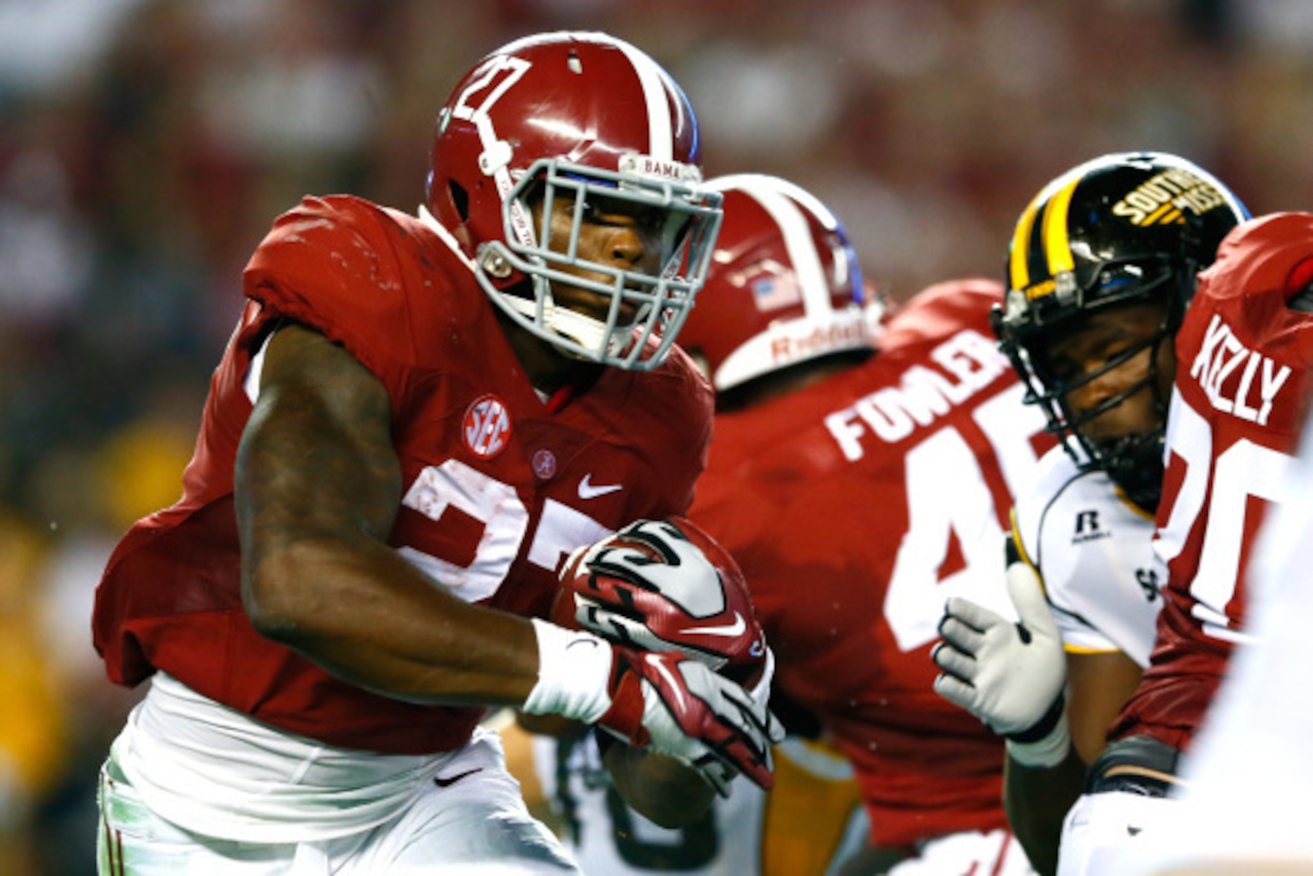 TUSCALOOSA, AL - SEPTEMBER 13: Derrick Henry #27 of the Alabama Crimson Tide rushes against the Southern Miss Golden Eagles at Bryant-Denny Stadium on September 13, 2014 in Tuscaloosa, Alabama. (Photo by Kevin C. Cox/Getty Images) TUSCALOOSA, AL - SEPTEMBER 13: Derrick Henry #27 of the Alabama Crimson Tide rushes against the Southern Miss Golden Eagles at Bryant-Denny Stadium on September 13, 2014 in Tuscaloosa, Alabama. (Photo by Kevin C. Cox/Getty Images)