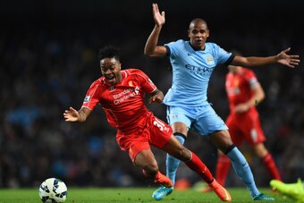 MANCHESTER, ENGLAND - AUGUST 25:  Raheem Sterling of Liverpool is challenged by Fernando Reges of Manchester City during the Barclays Premier League match between Manchester City and Liverpool at the Etihad Stadium on August 25, 2014 in Manchester, Englan