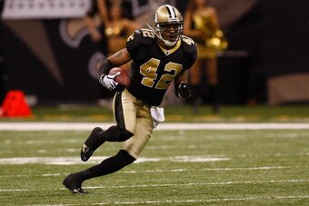 NEW ORLEANS - NOVEMBER 30:  Darren Sharper #42 of the New Orleans Saints intercepts the ball against the New England Patriots at the Louisiana Superdome on November 30, 2009  in New Orleans, Louisiana.  (Photo by Chris Graythen/Getty Images)