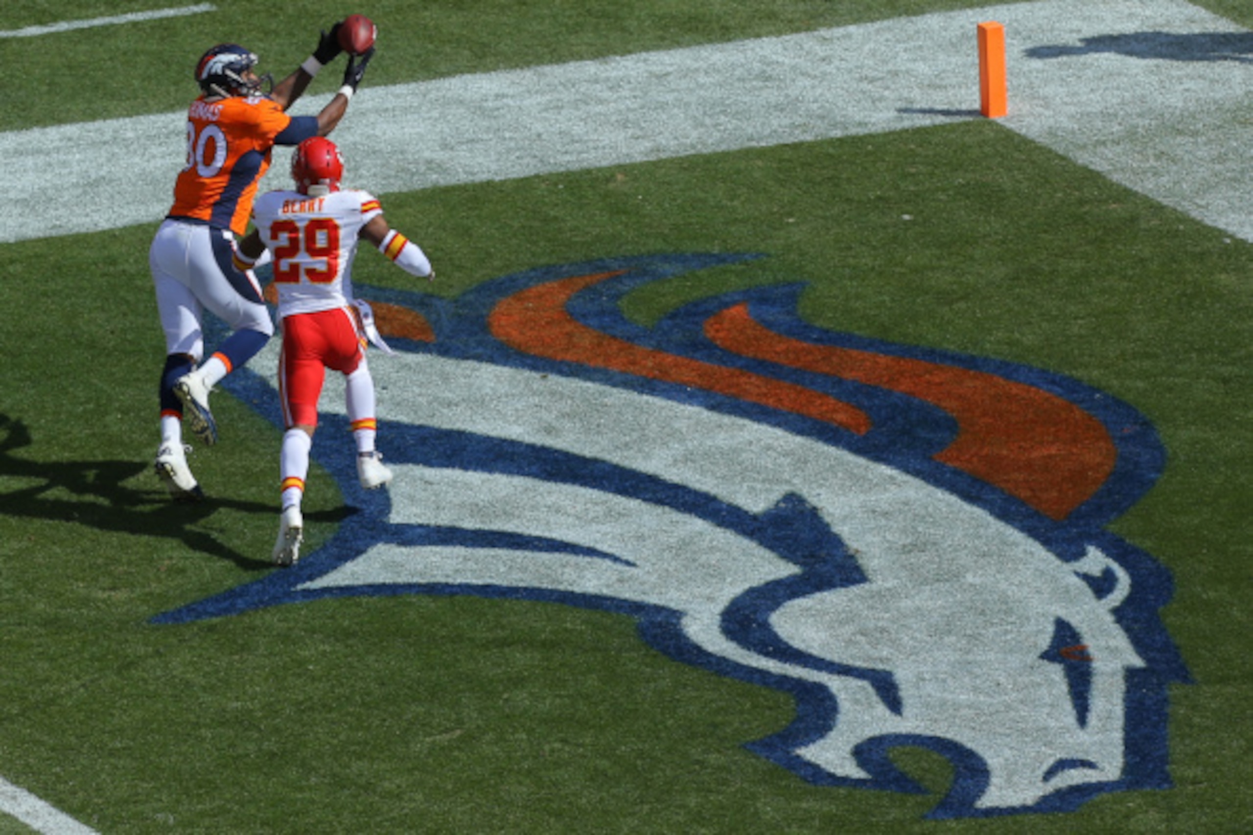DENVER, CO - SEPTEMBER 14:  Tight end Julius Thomas #80 of the Denver Broncos has a touchdown reception under coverage by strong safety Eric Berry #29 of the Kansas City Chiefs in the first quarter of a game at Sports Authority Field at Mile High on Septe