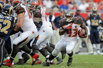 TAMPA, FL - SEPTEMBER 14: Bobby Rainey #43 of the Tampa Bay Buccaneers rushes during the second quarter of the game against the St. Louis Rams at Raymond James Stadium on September 14, 2014 in Tampa, Florida.  (Photo by Cliff McBride/Getty Images)