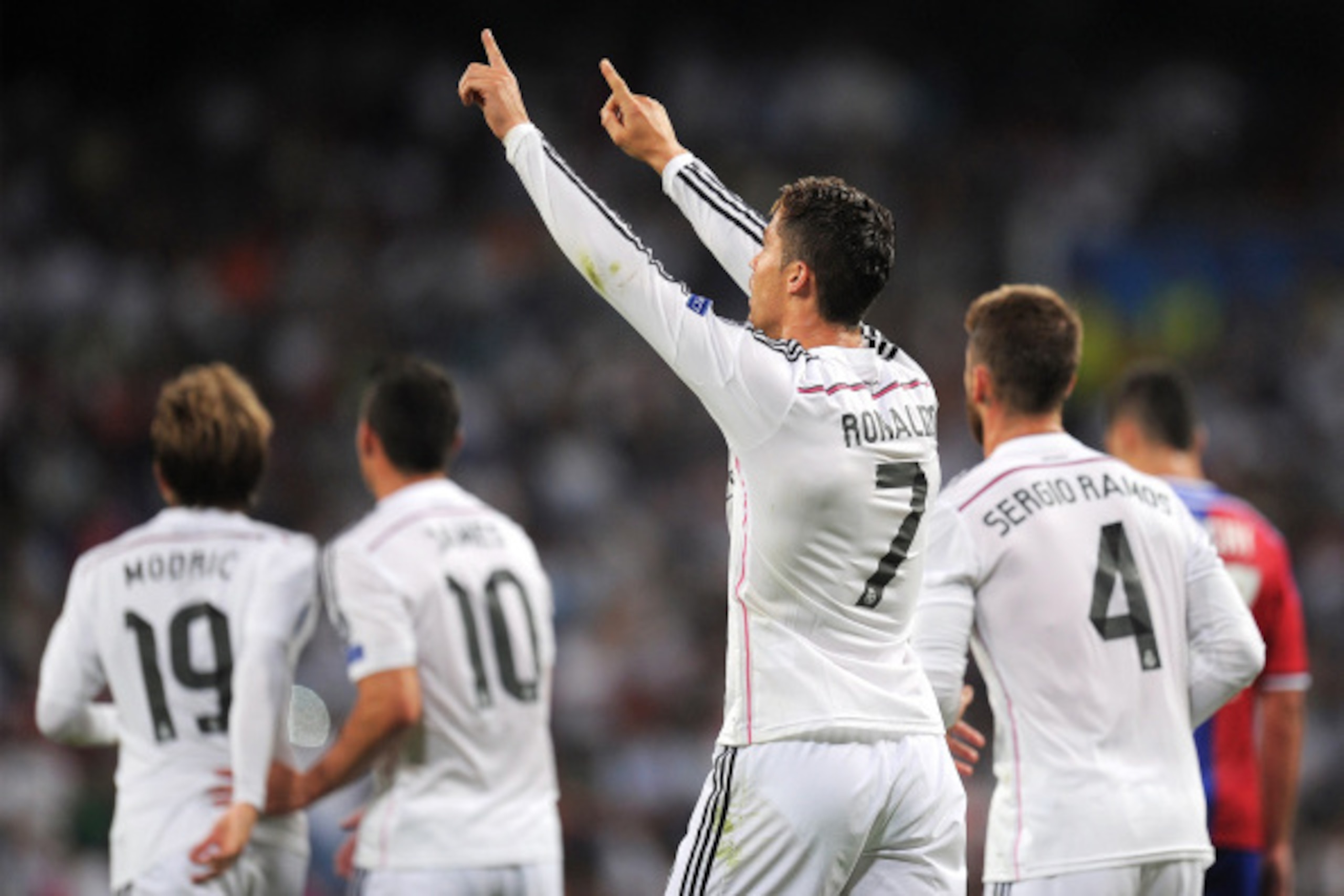 MADRID, SPAIN - SEPTEMBER 16:  Cristiano Ronaldo of Real Madrid celebrates after scoring Real's 3rd goal during the UEFA Champions League Group B match between Real Madrid CF and FC Basel 1893 on September 16, 2014 in Madrid, Spain.  (Photo by Denis Doyle
