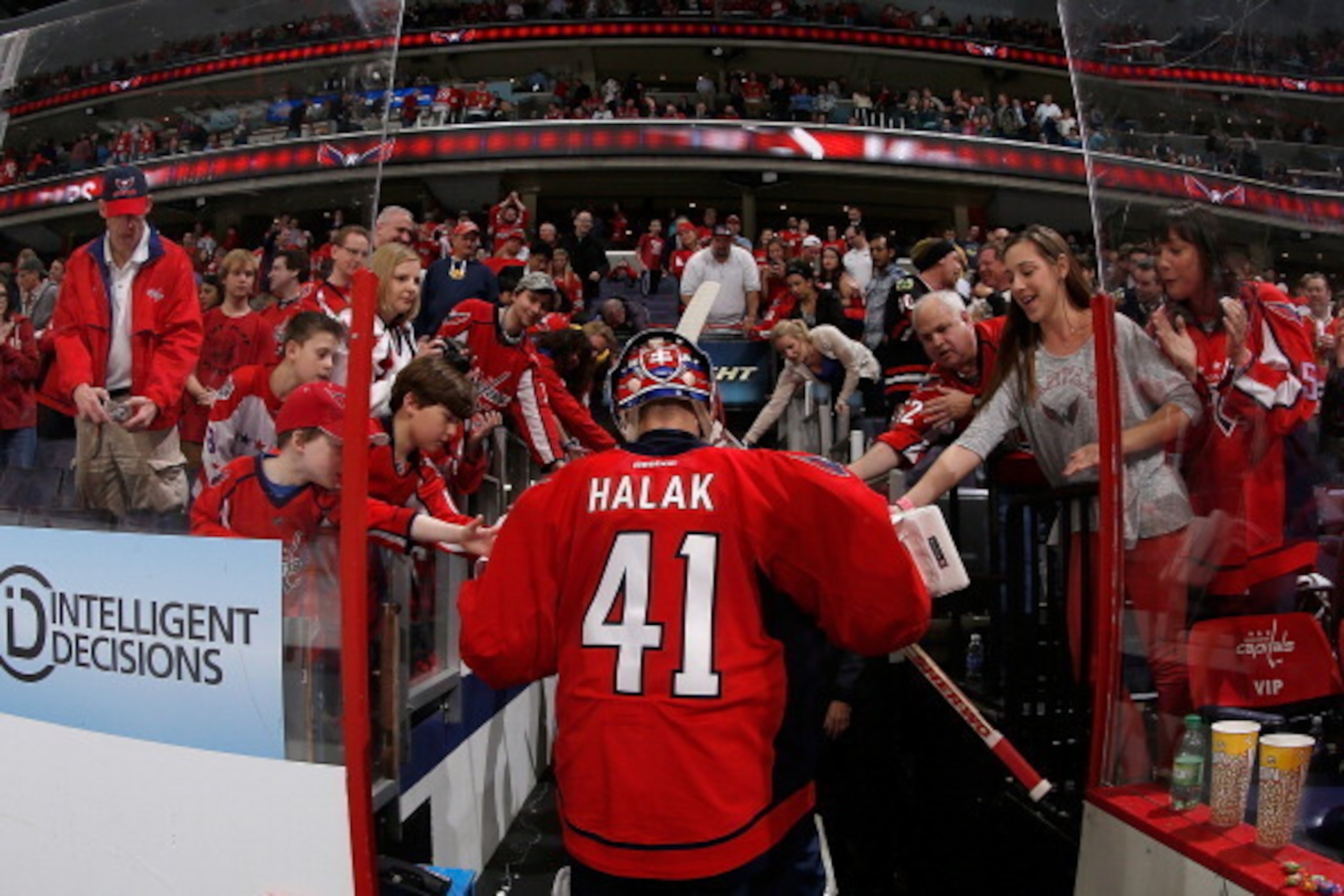 WASHINGTON, DC - APRIL 11: Jaroslav Halak #41 of the Washington Capitals celebrates with fans as he walks to the locker room after the Capitals defeated the Chicago Blackhawks 4-0 during an NHL game at Verizon Center on April 11, 2014 in Washington, DC. WASHINGTON, DC - APRIL 11: Jaroslav Halak #41 of the Washington Capitals celebrates with fans as he walks to the locker room after the Capitals defeated the Chicago Blackhawks 4-0 during an NHL game at Verizon Center on April 11, 2014 in Washington, DC.
