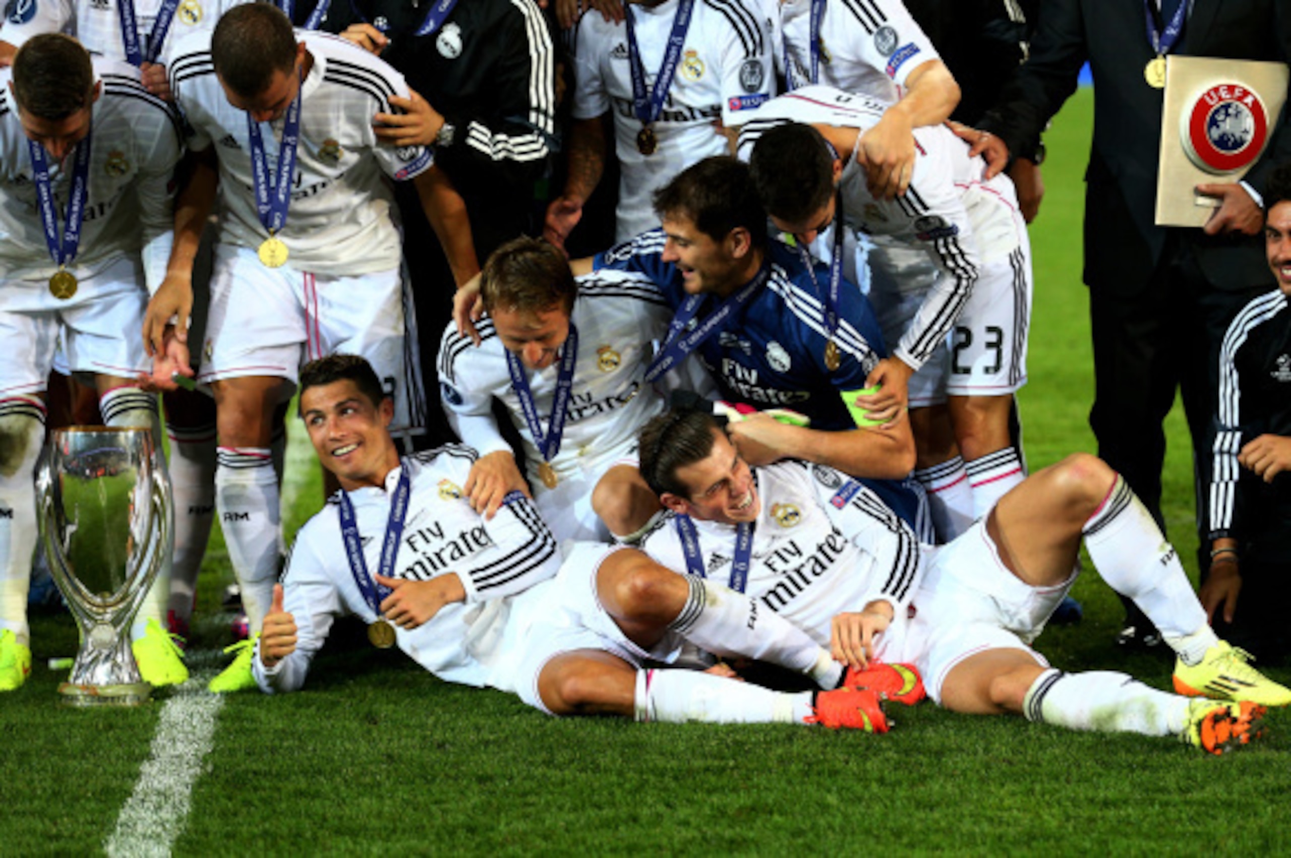 CARDIFF, WALES - AUGUST 12:  Cristiano Ronaldo of Real Madrid and Gareth Bale of Real Madrid celebrate with teammates following their team's 2-0 victory during the UEFA Super Cup between Real Madrid and Sevilla FC at Cardiff City Stadium on August 12, 201