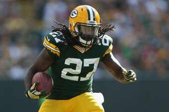 GREEN BAY, WI - SEPTEMBER 14:  Running back Eddie Lacy #27 of the Green Bay Packers rushes the football against the New York Jets during the NFL game at Lambeau Field on September 14, 2014 in Green Bay, Wisconsin.  The Packers defeated the Jets 31-24.  (P