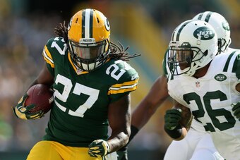 GREEN BAY, WI - SEPTEMBER 14:  Running back Eddie Lacy #27 of the Green Bay Packers rushes the football against the New York Jets during the NFL game at Lambeau Field on September 14, 2014 in Green Bay, Wisconsin.  The Packers defeated the Jets 31-24.  (P