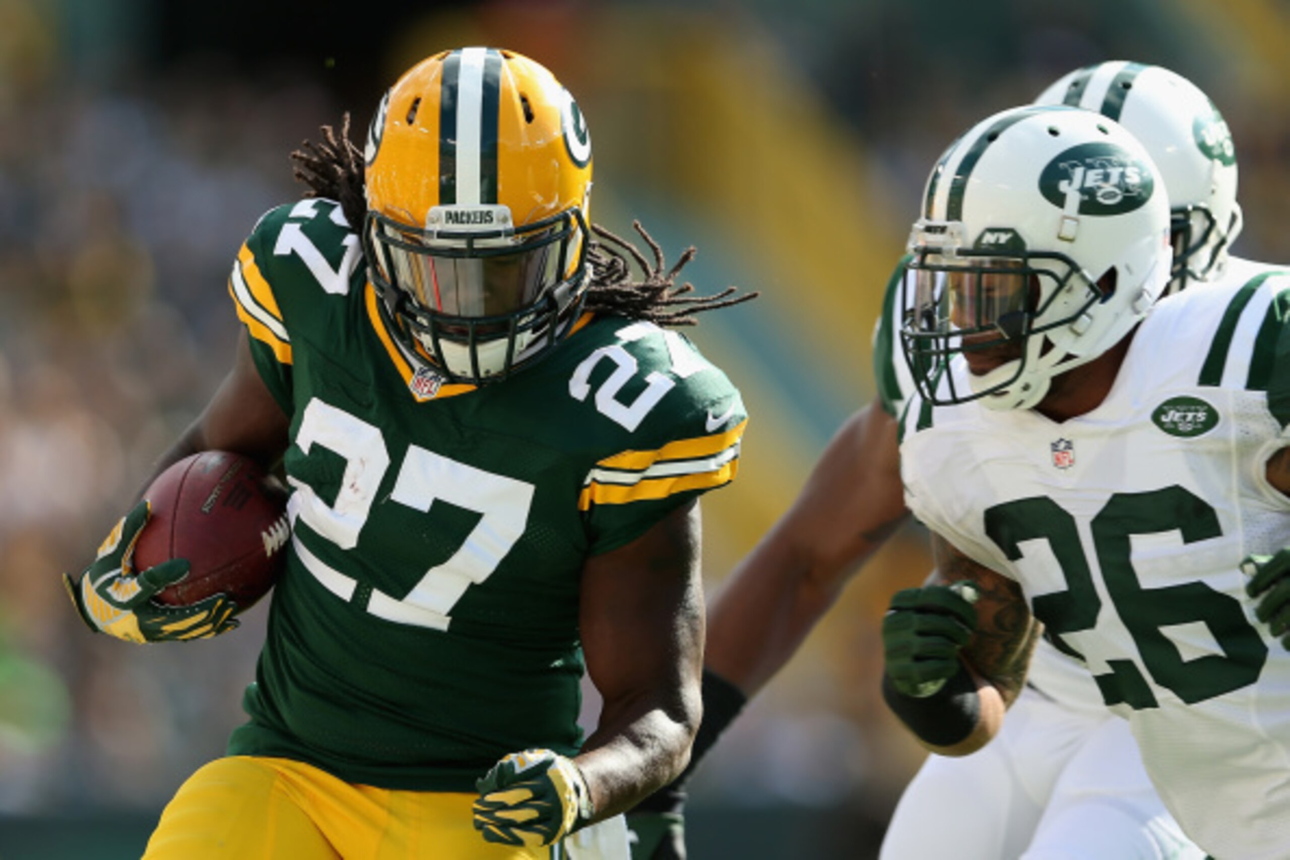 GREEN BAY, WI - SEPTEMBER 14:  Running back Eddie Lacy #27 of the Green Bay Packers rushes the football against the New York Jets during the NFL game at Lambeau Field on September 14, 2014 in Green Bay, Wisconsin.  The Packers defeated the Jets 31-24.  (P