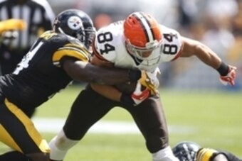 Sep 7, 2014; Pittsburgh, PA, USA; Cleveland Browns tight end Jordan Cameron (84) is tackled after a pass reception by Pittsburgh Steelers inside linebacker Lawrence Timmons (94) during the first quarter at Heinz Field. Mandatory Credit: Charles LeClaire-U