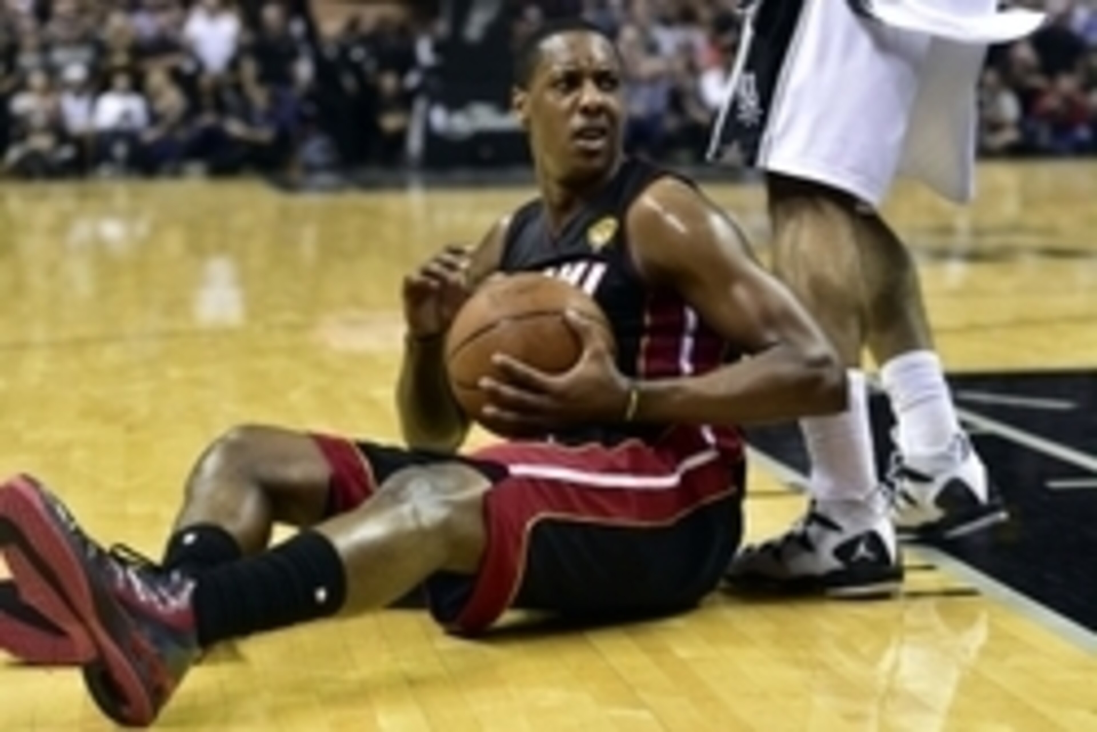 Jun 15, 2014; San Antonio, TX, USA; Miami Heat guard Mario Chalmers (15) reacts on the floor during the fourth quarter against the San Antonio Spurs in game five of the 2014 NBA Finals at AT&T Center. Mandatory Credit: Bob Donnan-USA TODAY Sports Jun 15, 2014; San Antonio, TX, USA; Miami Heat guard Mario Chalmers (15) reacts on the floor during the fourth quarter against the San Antonio Spurs in game five of the 2014 NBA Finals at AT&T Center. Mandatory Credit: Bob Donnan-USA TODAY Sports