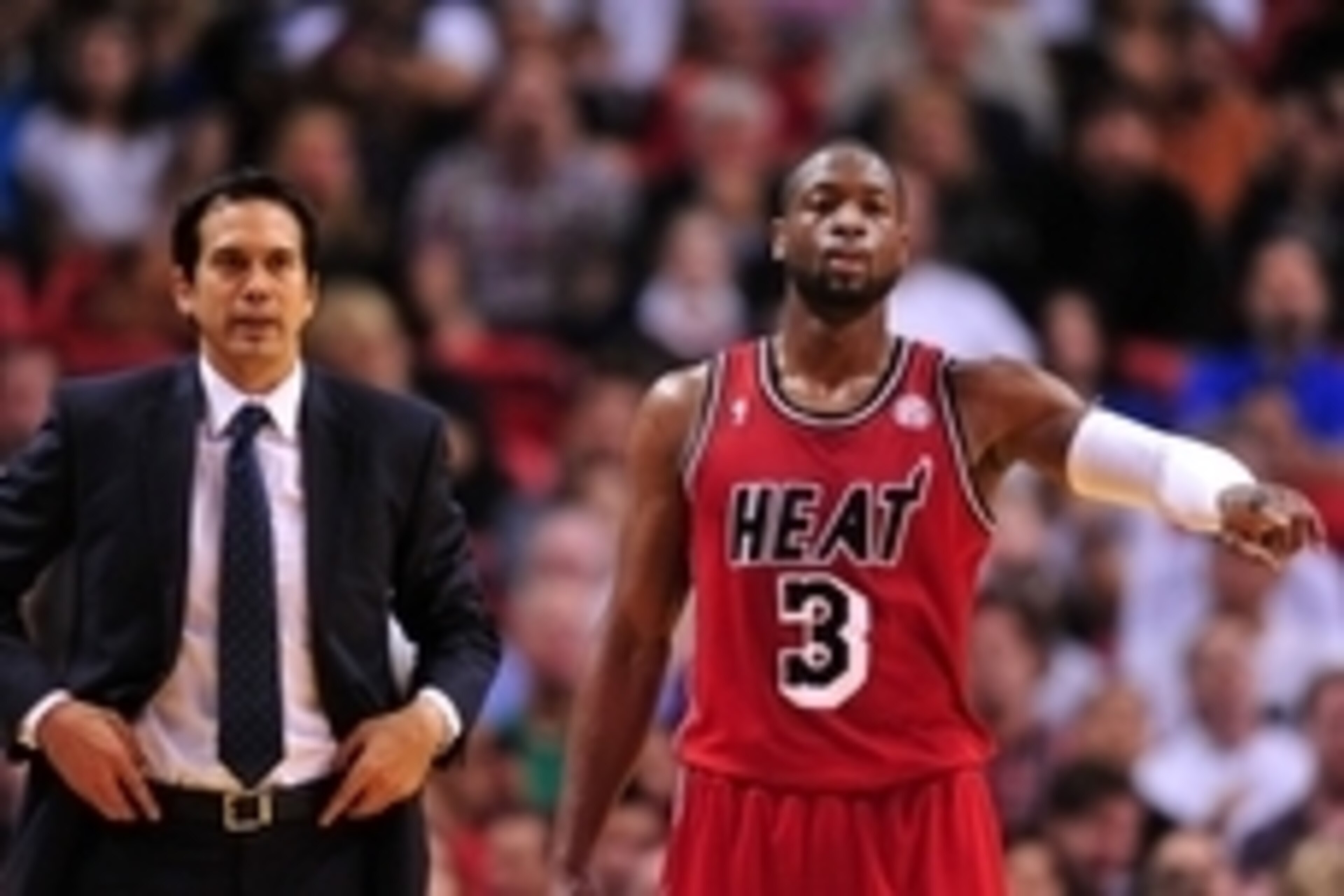 Feb 24, 2013; Miami, FL, USA; Miami Heat head coach Erik Spoelstra (left) and shooting guard Dwyane Wade (right) react during the second half against the Cleveland Cavaliers at the American Airlines Arena. MIami won 109-105. Mandatory Credit: Steve Mitch Feb 24, 2013; Miami, FL, USA; Miami Heat head coach Erik Spoelstra (left) and shooting guard Dwyane Wade (right) react during the second half against the Cleveland Cavaliers at the American Airlines Arena. MIami won 109-105. Mandatory Credit: Steve Mitch