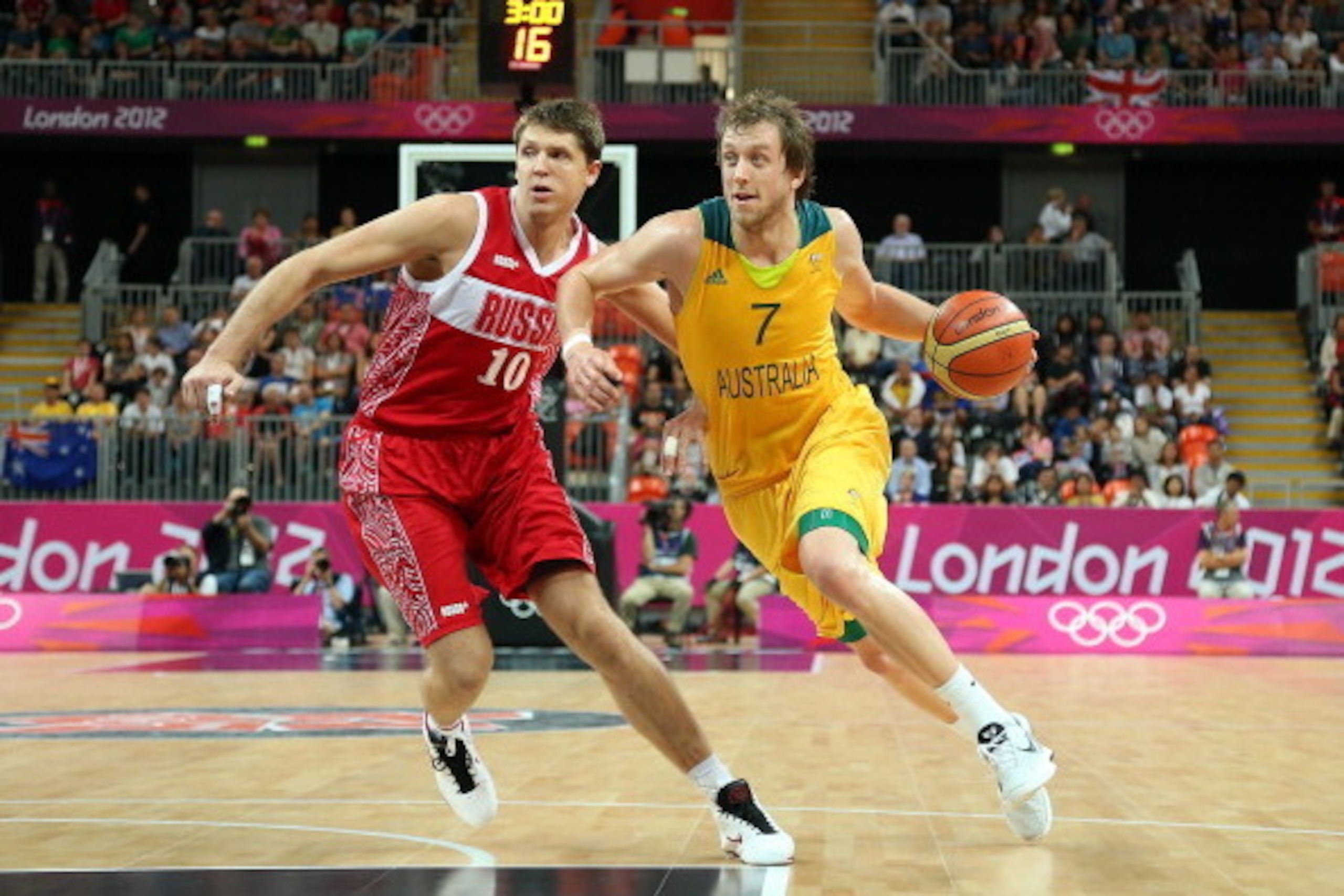 LONDON, ENGLAND - AUGUST 06: Joe Ingles #7 of Australia drives the ball past Victor Khryapa #10 of Russia during the Men's Basketball Preliminary Round match on Day 10 of the London 2012 Olympic Games at the Basketball Arena on August 6, 2012 in London, LONDON, ENGLAND - AUGUST 06: Joe Ingles #7 of Australia drives the ball past Victor Khryapa #10 of Russia during the Men's Basketball Preliminary Round match on Day 10 of the London 2012 Olympic Games at the Basketball Arena on August 6, 2012 in London,