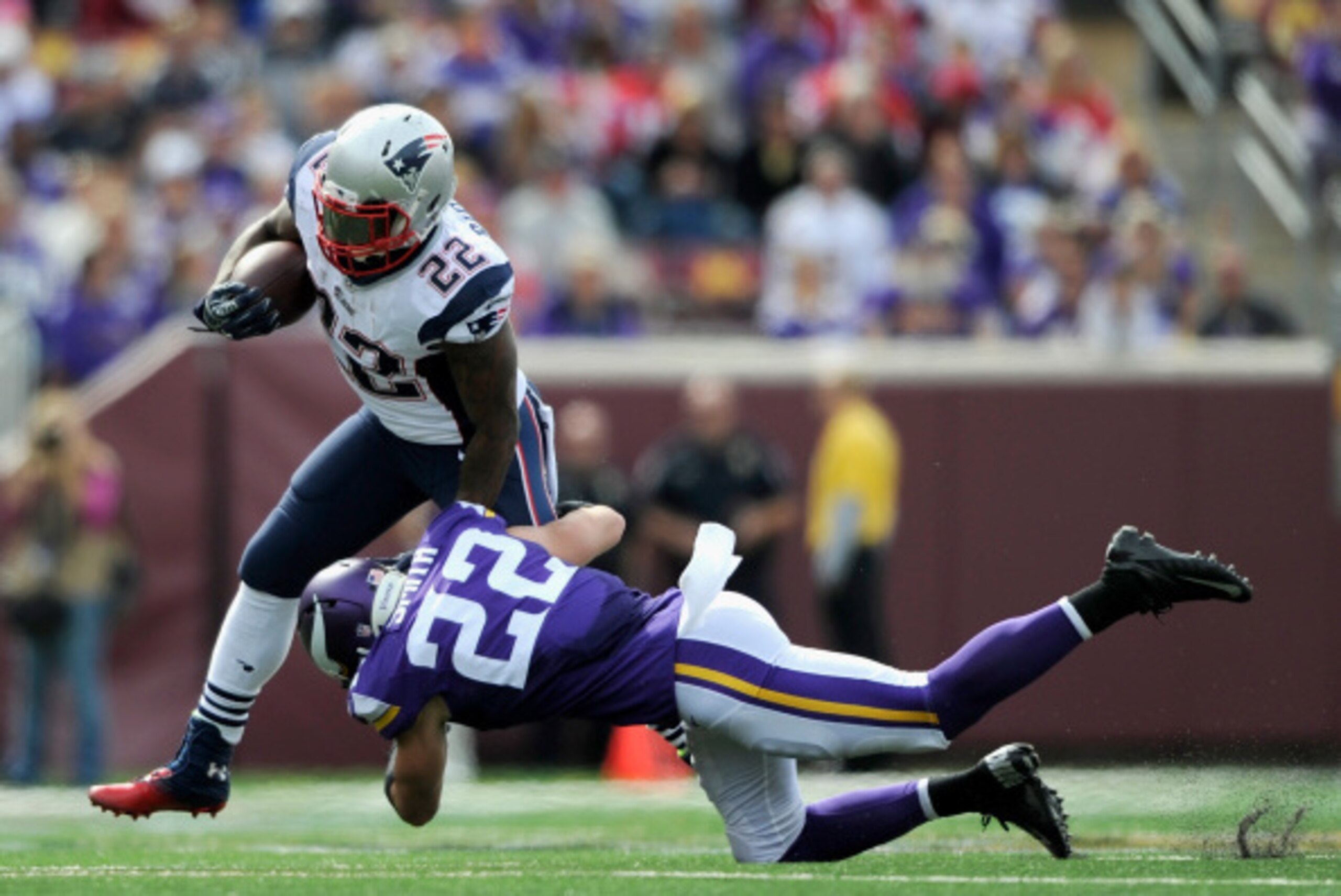 MINNEAPOLIS, MN - SEPTEMBER 14: Stevan Ridley #22 of the New England Patriots avoids a tackle by Harrison Smith #22 of the Minnesota Vikings during the fourth quarter of the game on September 14, 2014 at TCF Bank Stadium in Minneapolis, Minnesota. The Pat