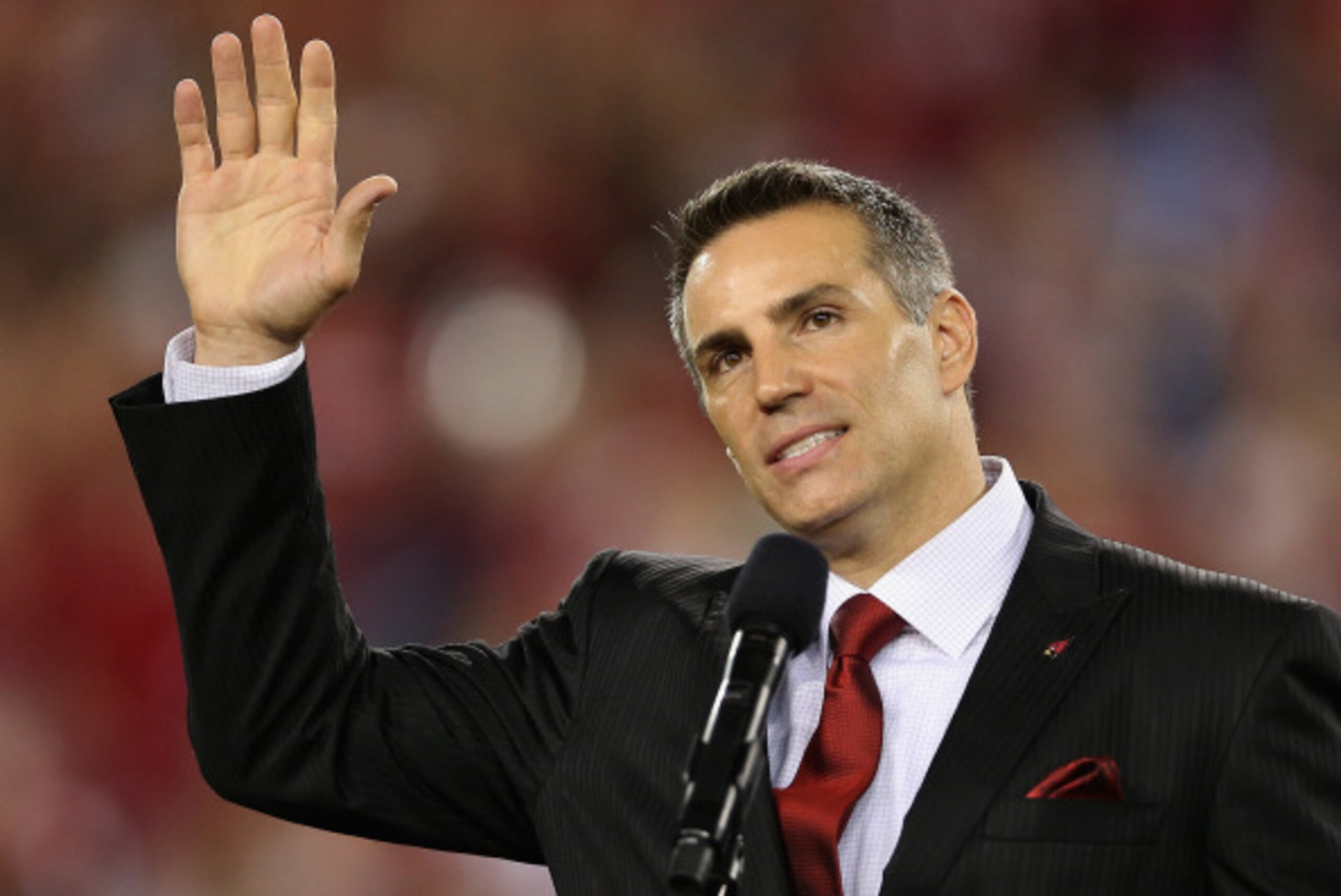 GLENDALE, AZ - SEPTEMBER 08:  Former Arizona Cardinals quarterback Kurt Warner is inducted into the Arizona Cardinals Ring of Honor during halftime of the NFL game against the San Diego Chargers at the University of Phoenix Stadium on September 8, 2014 in