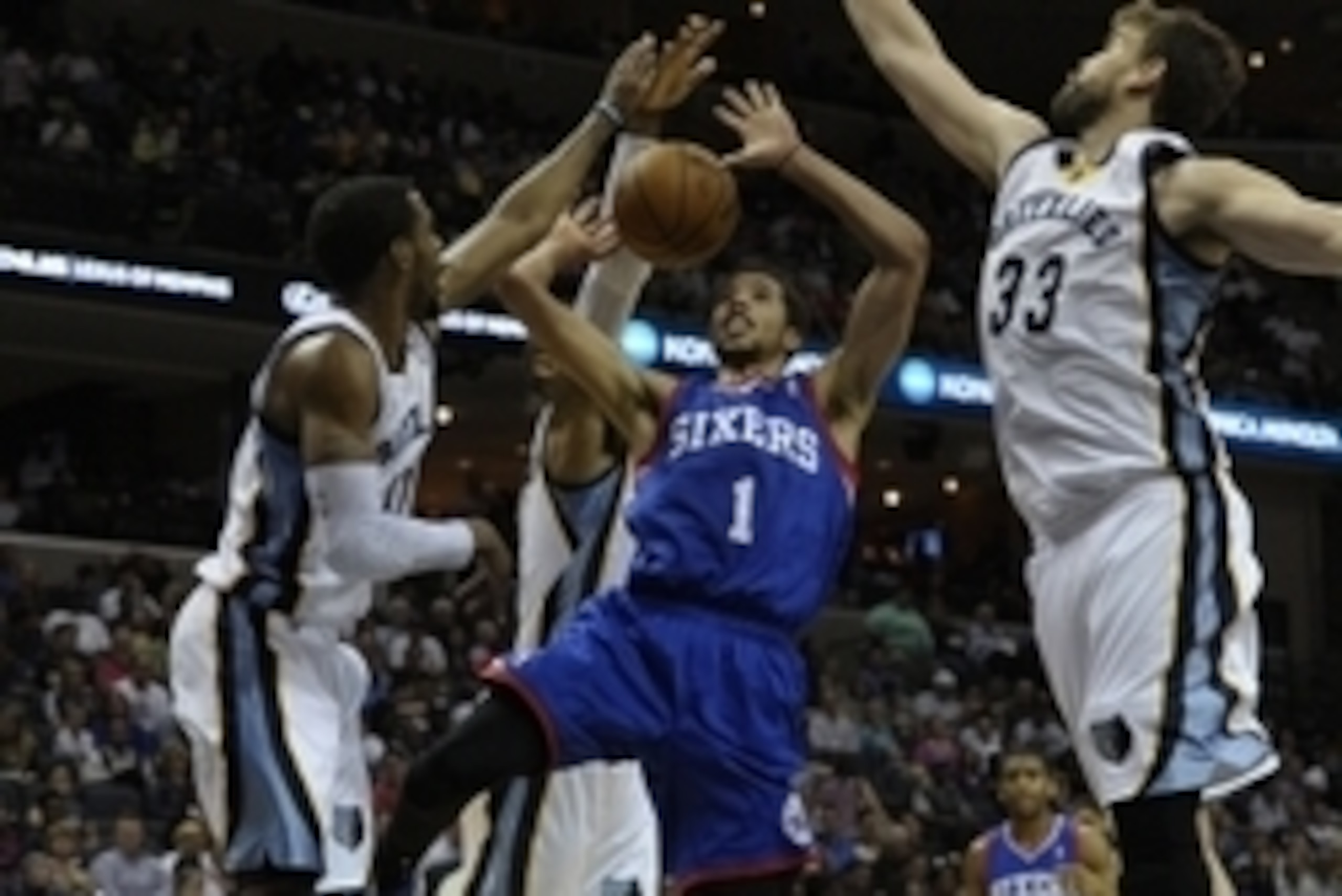 Apr 11, 2014; Memphis, TN, USA; Philadelphia 76ers guard Michael Carter-Williams (1) lays the ball up between Memphis Grizzlies guard Mike Conley (11) and Memphis Grizzlies center Marc Gasol (33) during the game at FedExForum. Memphis Grizzlies beat Phila