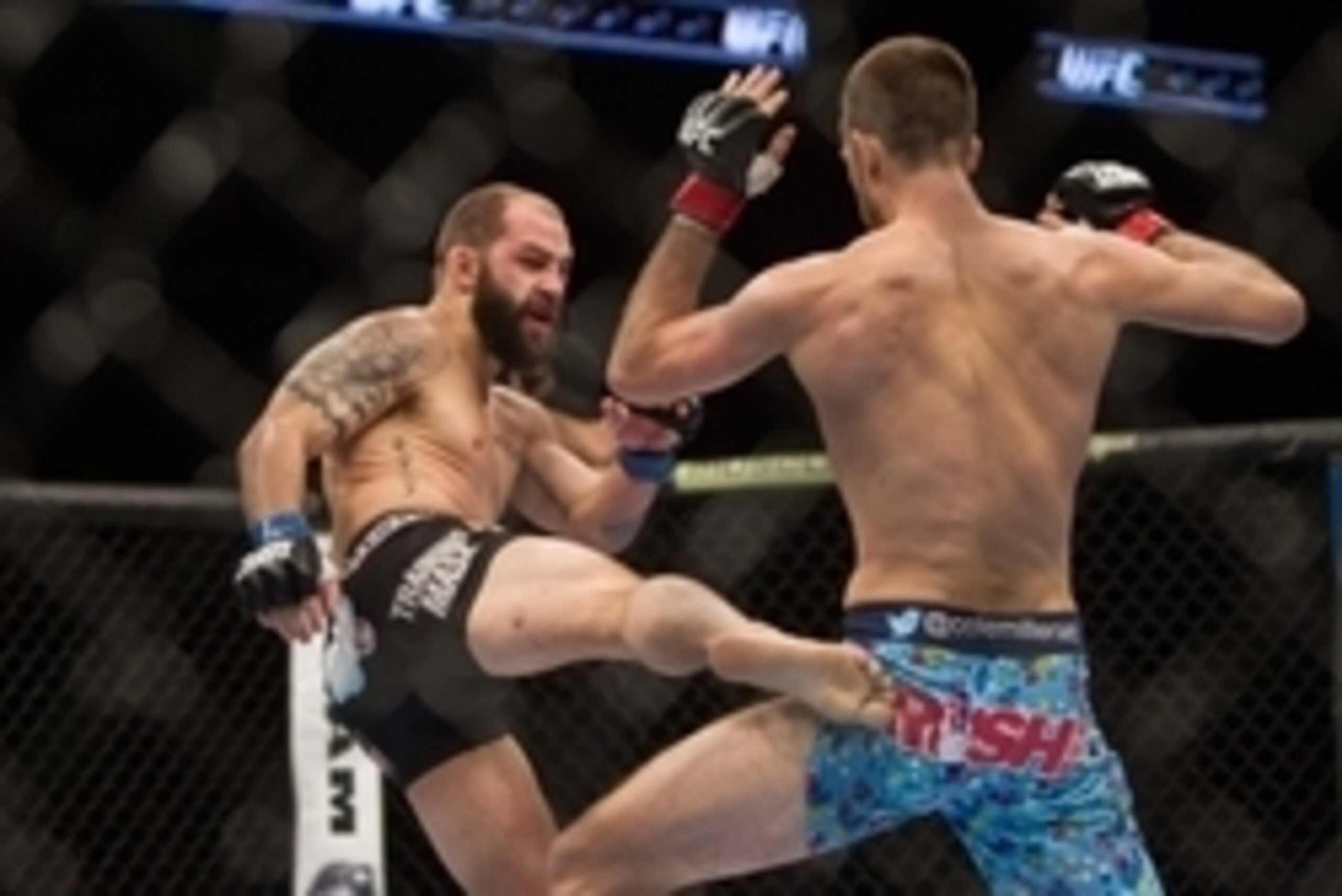 Jan 15, 2014; Duluth, GA, USA;  Cole Miller (red gloves) fights Sam Sicilia (blue gloves) during UFC Fight Night at Gwinnett Center. Miller won. Mandatory Credit: Joshua S. Kelly-USA TODAY Sports