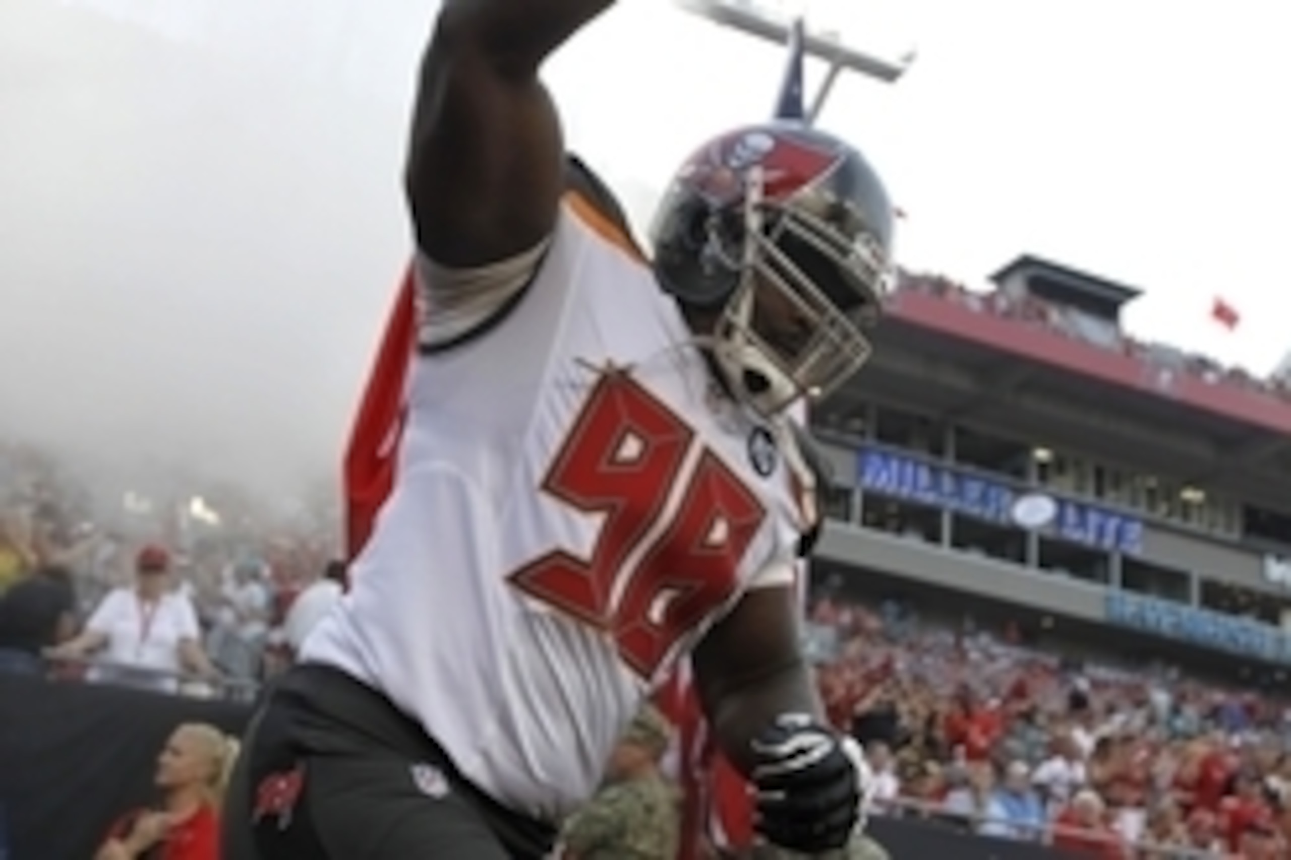 Aug 16, 2014; Tampa, FL, USA; Tampa Bay Buccaneers defensive tackle Clinton McDonald (98) runs out of the tunnel before the game against the Miami Dolphins at Raymond James Stadium. Mandatory Credit: Kim Klement-USA TODAY Sports