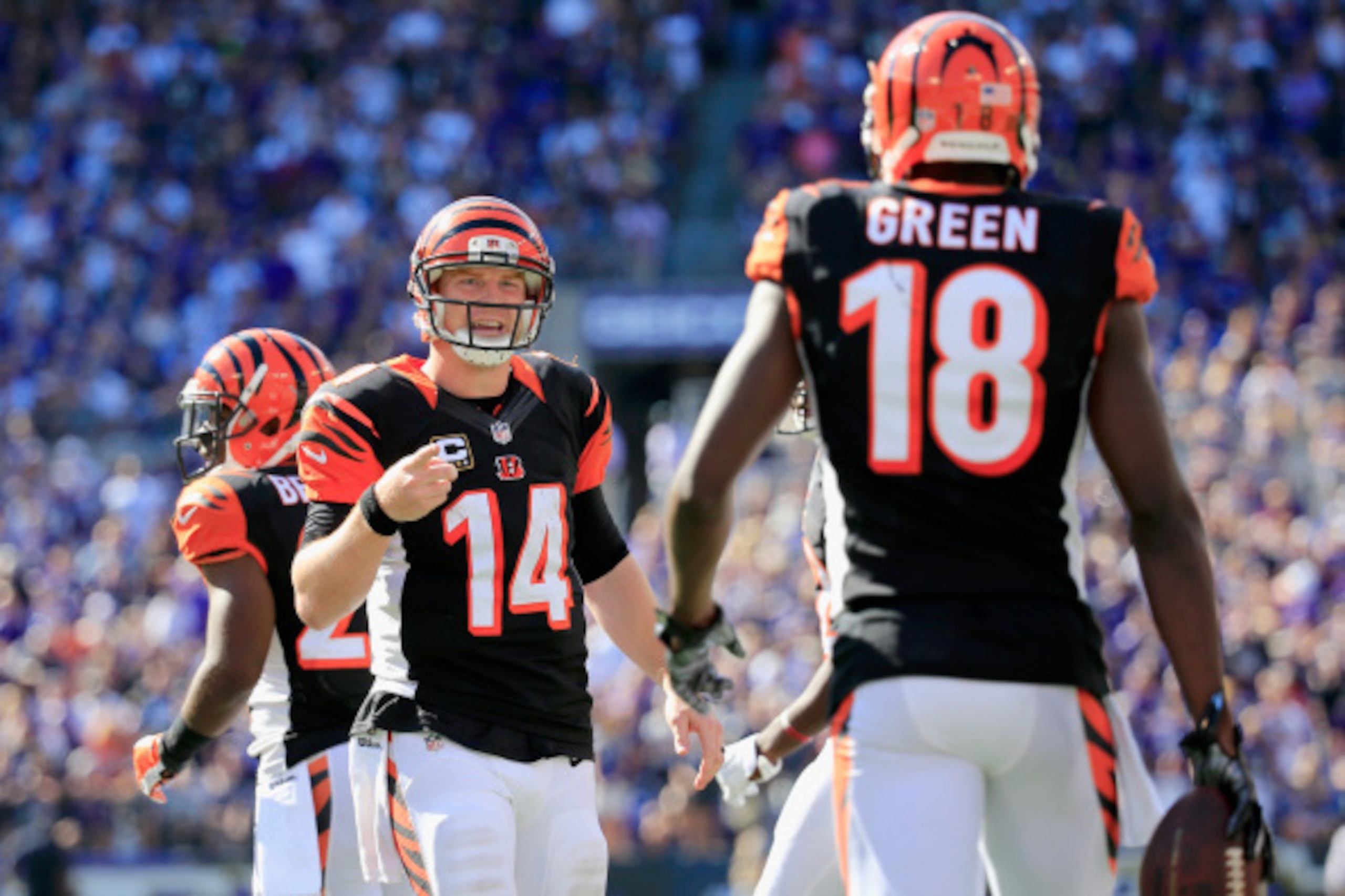 BALTIMORE, MD - SEPTEMBER 07:  Quarterback Andy Dalton #14 of the Cincinnati Bengals celebrates with wide receiver A.J. Green #18 after Green's game winning touchdown during an NFL football game against the Baltimore Ravens at M&T Bank Stadium on Septembe