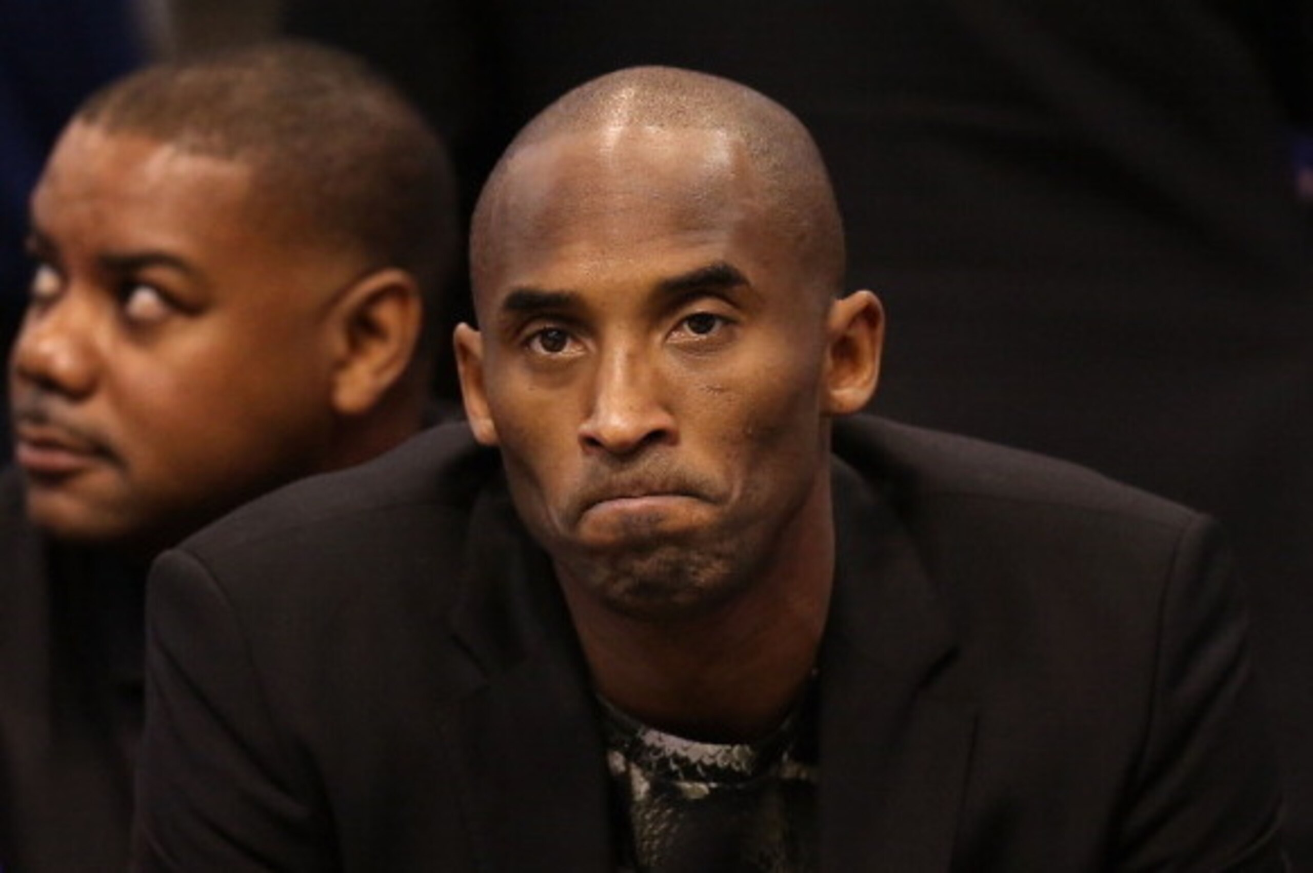 PHOENIX, AZ - JANUARY 15:  Kobe Bryant #24 of the Los Angeles Lakers watches from the bench during the NBA game against the Phoenix Suns at US Airways Center on January 15, 2014 in Phoenix, Arizona.  NOTE TO USER: User expressly acknowledges and agrees th