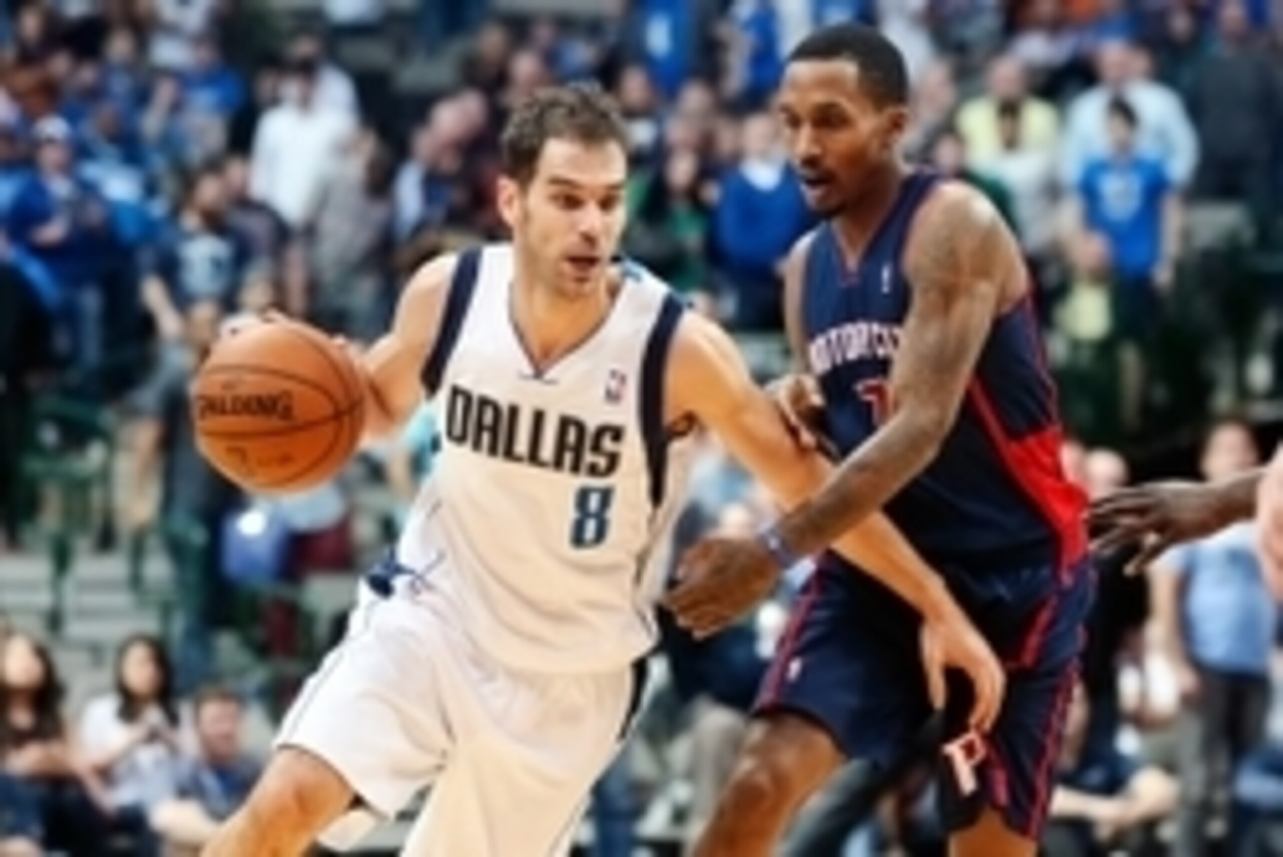 Jan 26, 2014; Dallas, TX, USA; Dallas Mavericks point guard Jose Calderon (8) drives to the basket past Detroit Pistons point guard Brandon Jennings (7) during the game at American Airlines Center. Dallas won 116-106. Mandatory Credit: Kevin Jairaj-USA TO