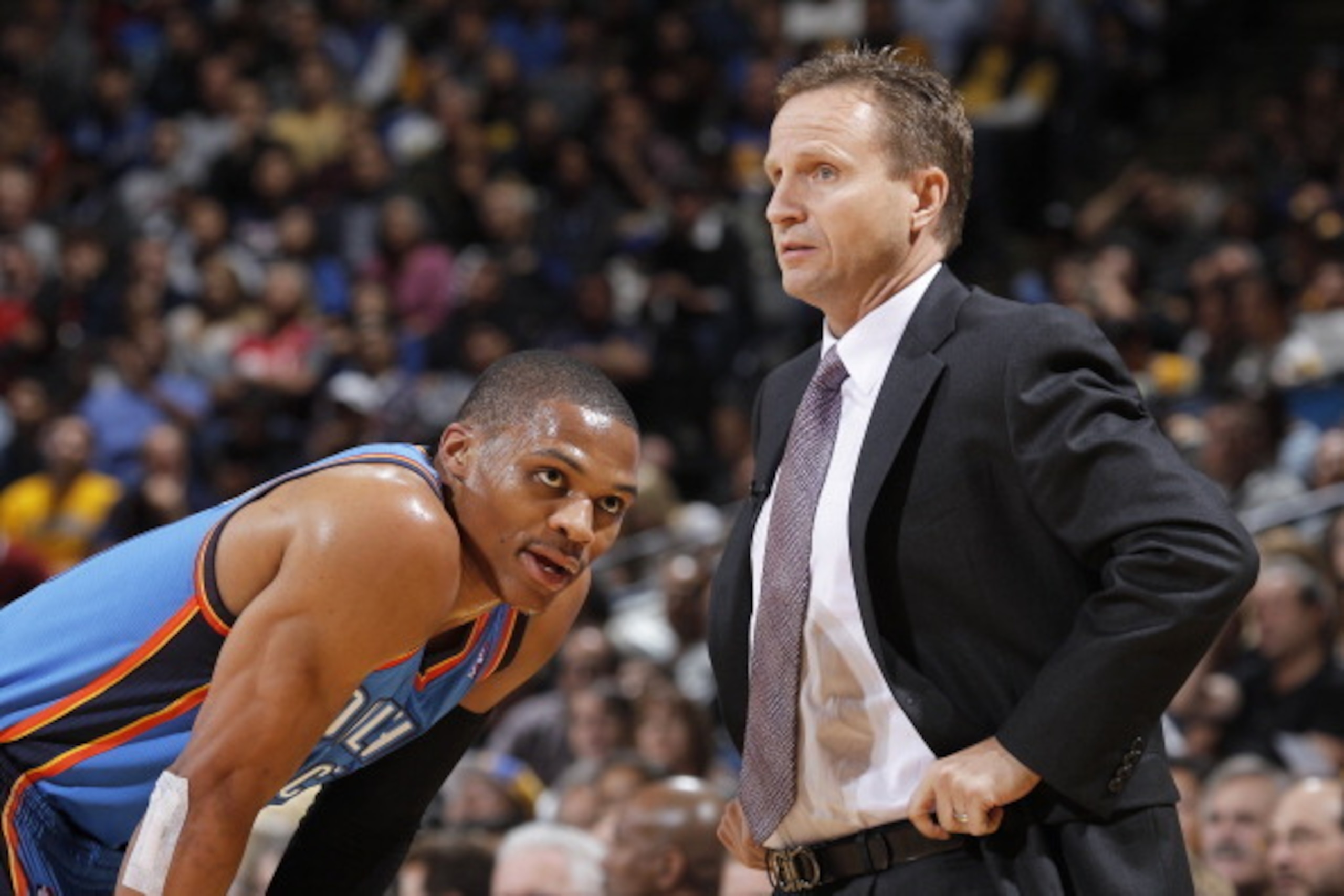 OAKLAND, CA - NOVEMBER 14: Head Coach Scott Brooks and Russell Westbrook #0 of the Oklahoma City Thunder in a game against the Golden State Warriors on November 14, 2013 at Oracle Arena in Oakland, California. NOTE TO USER: User expressly acknowledges and