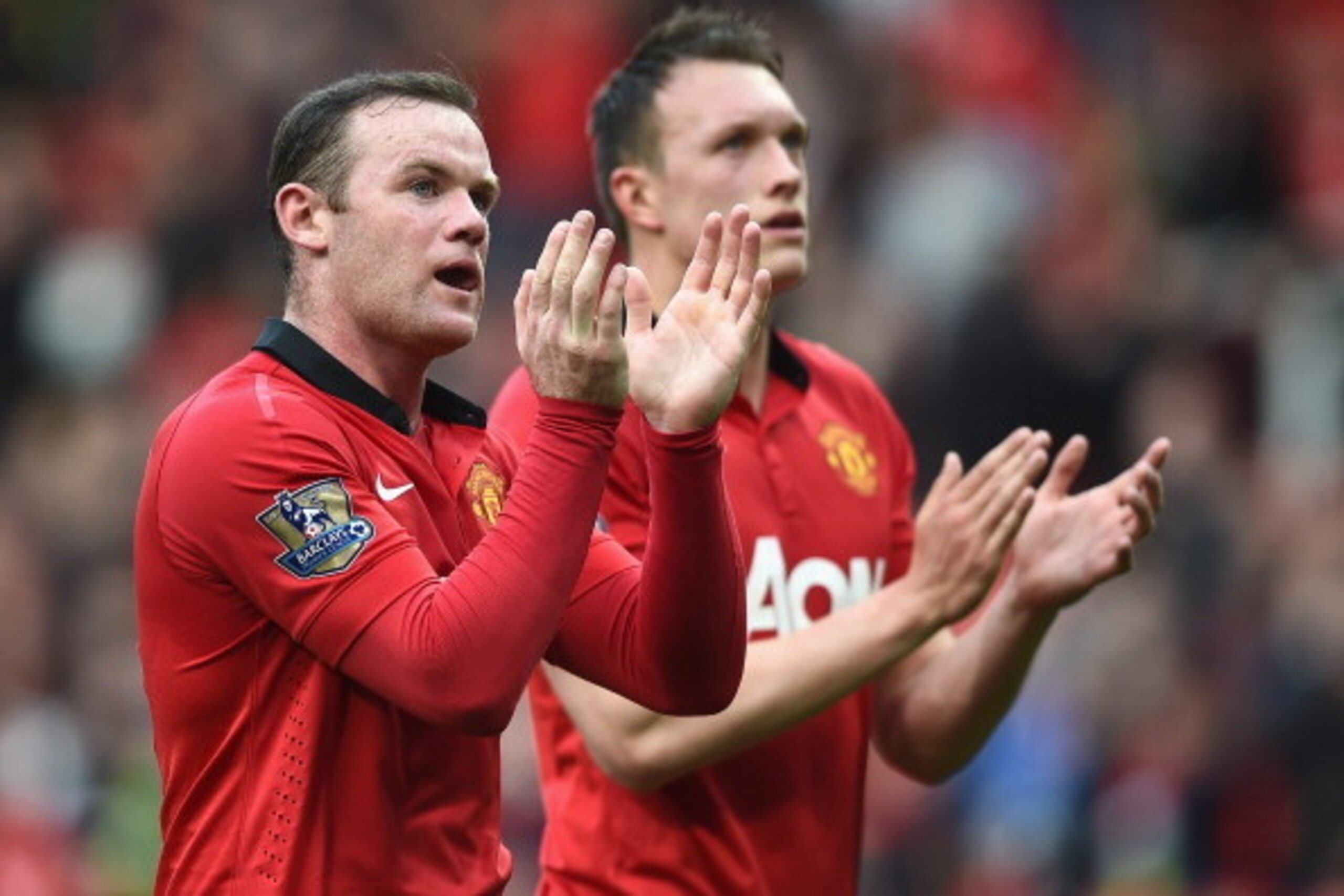 MANCHESTER, ENGLAND - APRIL 26: Wayne Rooney and Phil Jones of Manchester United applaud the fans after the Barclays Premier League match between Manchester United and Norwich City at Old Trafford on April 26, 2014 in Manchester, England. (Photo by Laure MANCHESTER, ENGLAND - APRIL 26: Wayne Rooney and Phil Jones of Manchester United applaud the fans after the Barclays Premier League match between Manchester United and Norwich City at Old Trafford on April 26, 2014 in Manchester, England. (Photo by Laure