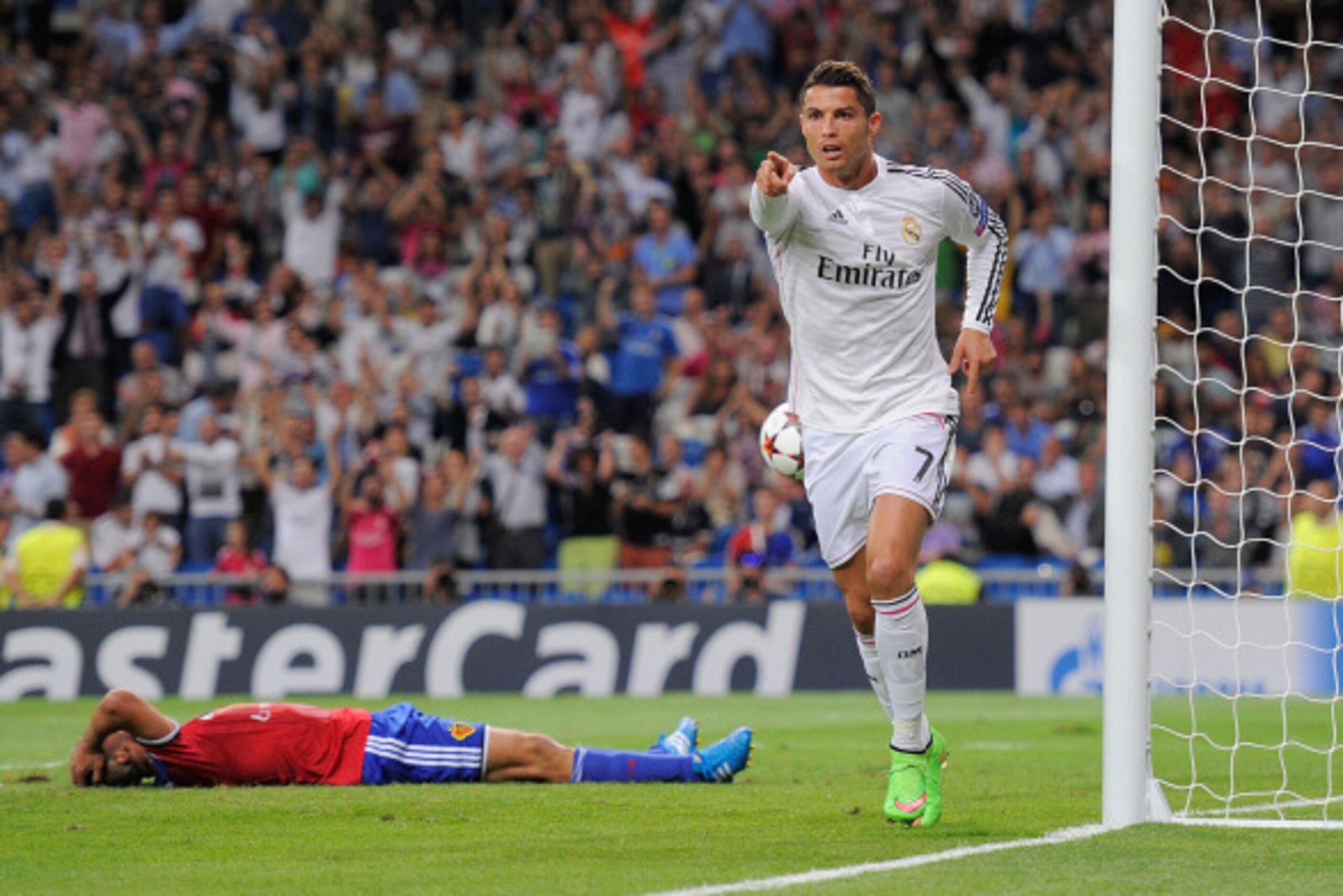 MADRID, SPAIN - SEPTEMBER 16:  Cristiano Ronaldo of Real Madrid celebrates after scoring Real's 3rd goal during the UEFA Champions League Group B match between Real Madrid CF and FC Basel 1893 on September 16, 2014 in Madrid, Spain.  (Photo by Denis Doyle