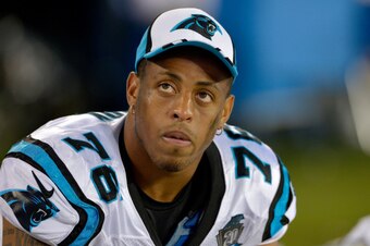 CHARLOTTE, NC - AUGUST 08:  Greg Hardy #76 of the Carolina Panthers watches from the bench during the fourth quarter of a loss to the Buffalo Bills at Bank of America Stadium on August 8, 2014 in Charlotte, North Carolina. Buffalo won 20-18.  (Photo by Gr