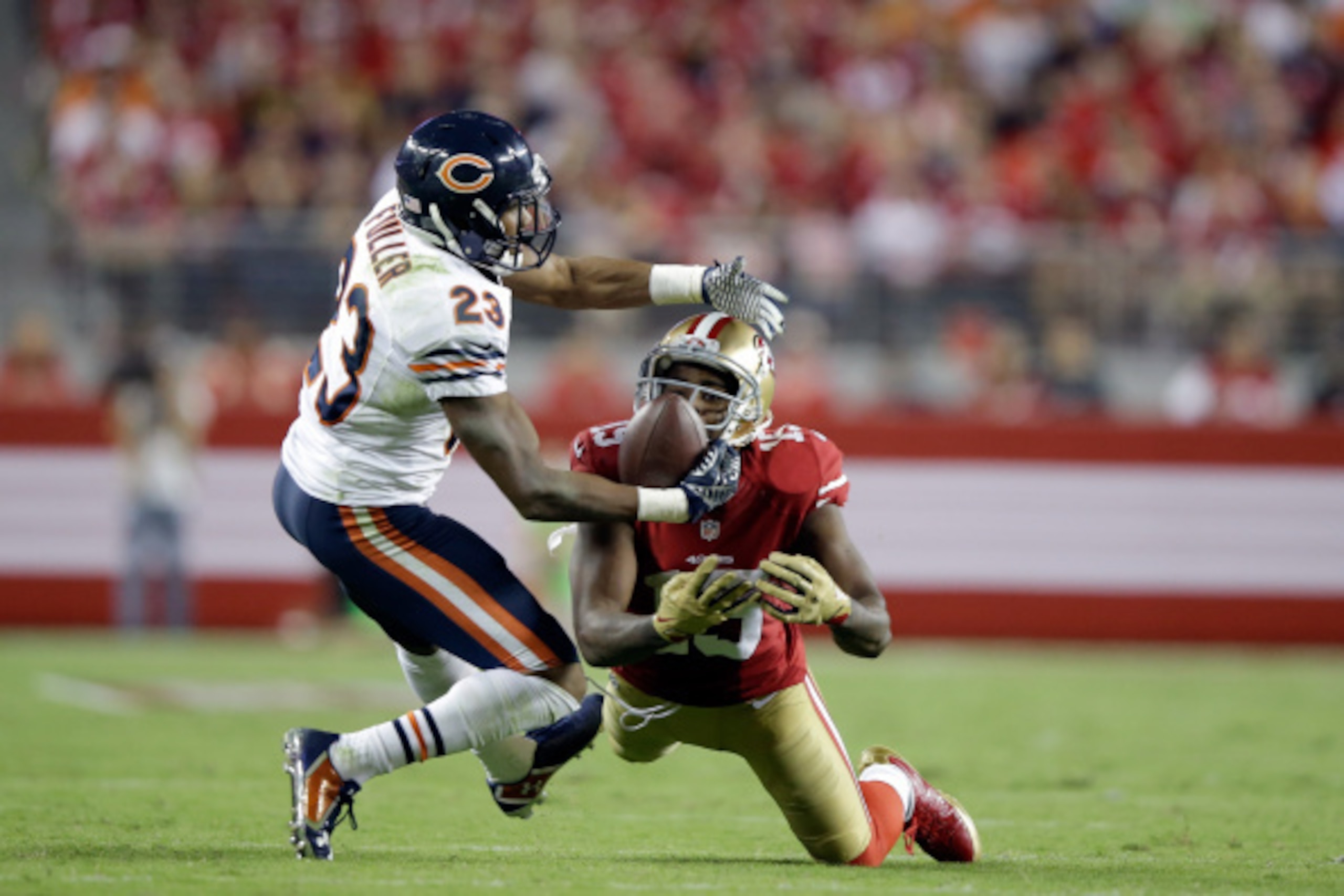SANTA CLARA, CA - SEPTEMBER 14:  Cornerback Kyle Fuller #23 of the Chicago Bears intercepts a pass intended for wide receiver Michael Crabtree #15 of the San Francisco 49ers at Levi's Stadium on September 14, 2014 in Santa Clara, California.  (Photo by Ez