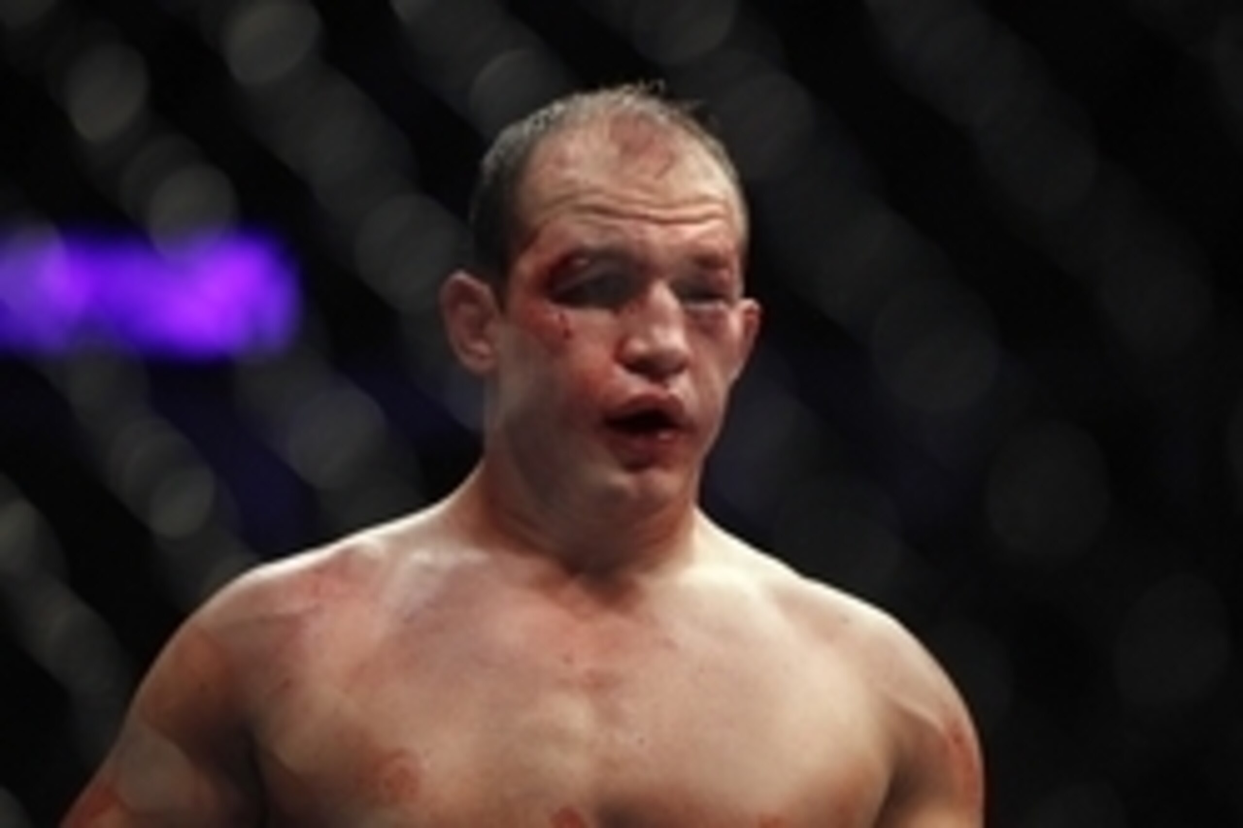 Oct 19, 2013; Houston, TX, USA; Junior Dos Santos (blue gloves) fights against Cain Velasquez (not pictured) in the world heavyweight championship bout during UFC 166 at Toyota Center. Mandatory Credit: Andrew Richardson-USA TODAY Sports
