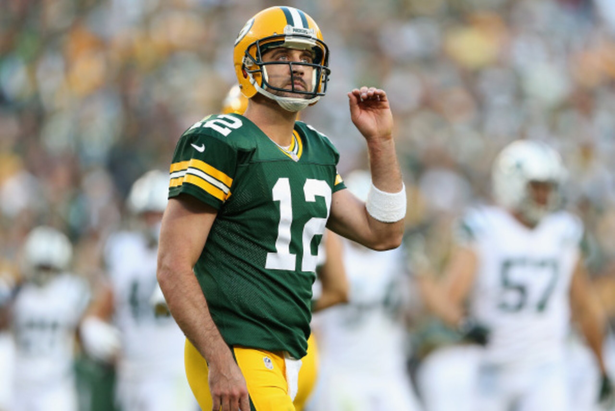 GREEN BAY, WI - SEPTEMBER 14:  Quarterback Aaron Rodgers #12 of the Green Bay Packers during the NFL game against the New York Jets at Lambeau Field on September 14, 2014 in Green Bay, Wisconsin.  The Packers defeated the Jets 31-24.  (Photo by Christian 