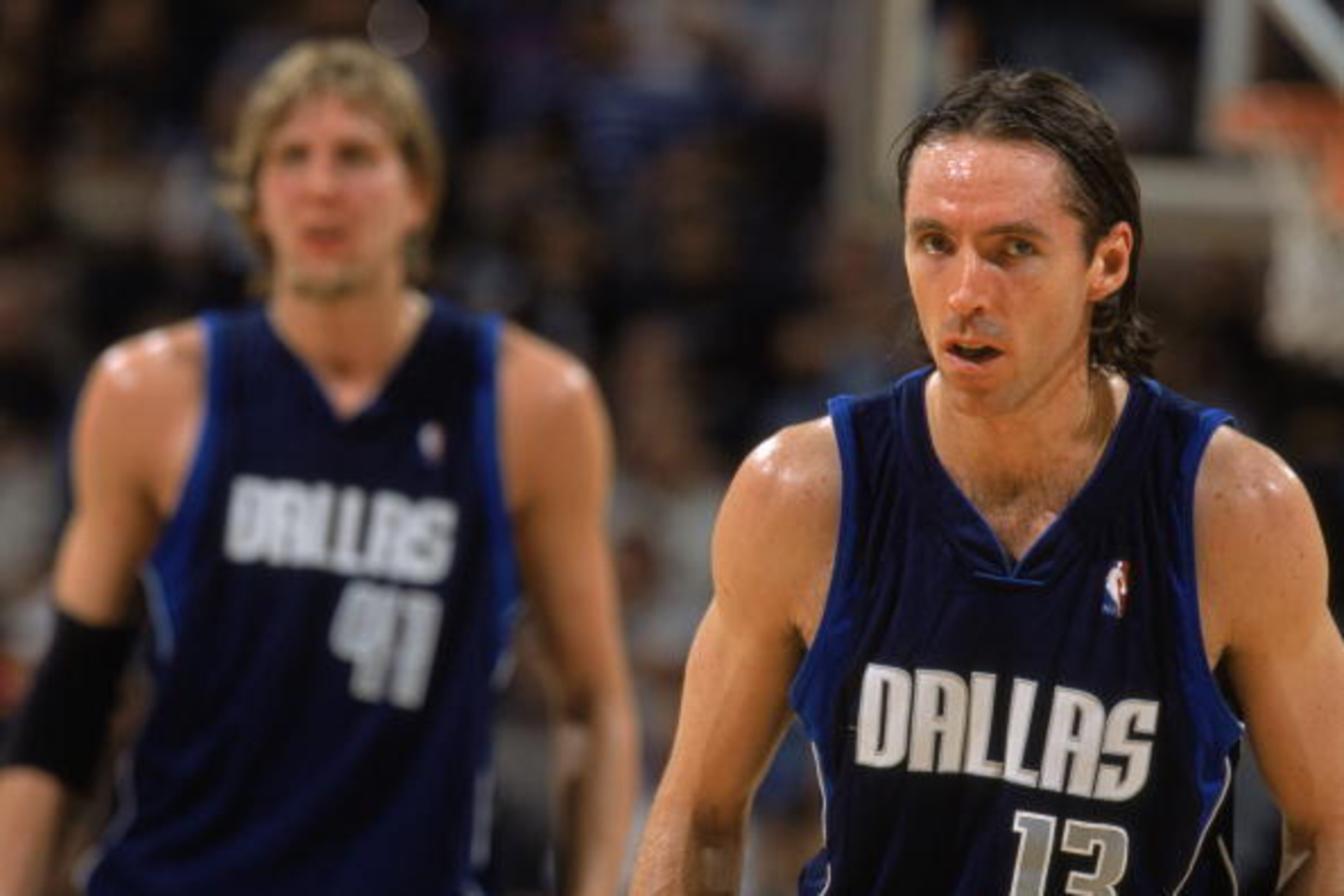 SAN ANTONIO - MAY 21:  Steve Nash #13 and Dirk Nowitzki #41 of the Dallas Mavericks wait for play to begin in Game Two of the Western Conference Finals against the San Antonio Spurs during the 2003 NBA Playoffs at SBC Center on May 21, 2003 in San Antonio