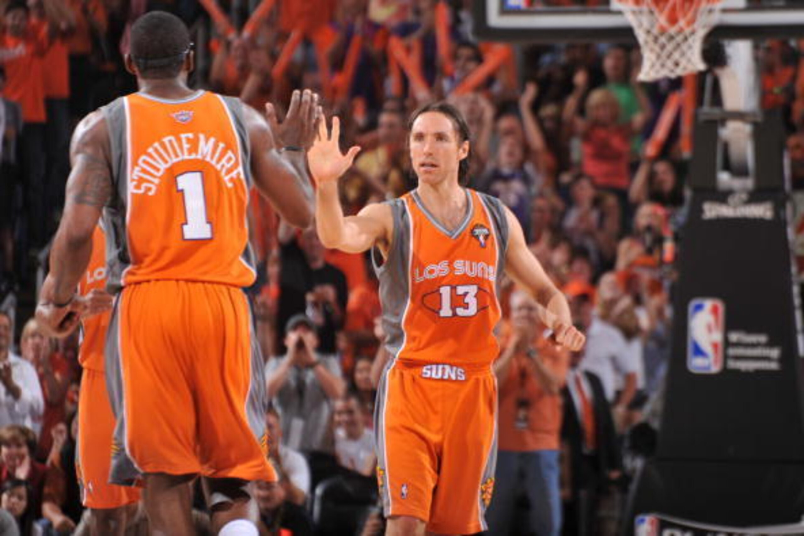 PHOENIX - MAY 5: Steve Nash #13 and Amar'e Stoudemire #1 of the Phoenix Suns celebrate against the San Antonio Spurs in Game Two of the Western Conference Semifinals during the 2010 NBA Playoffs at the U.S. Airways Center on May 5, 2010 in Phoenix, Arizon