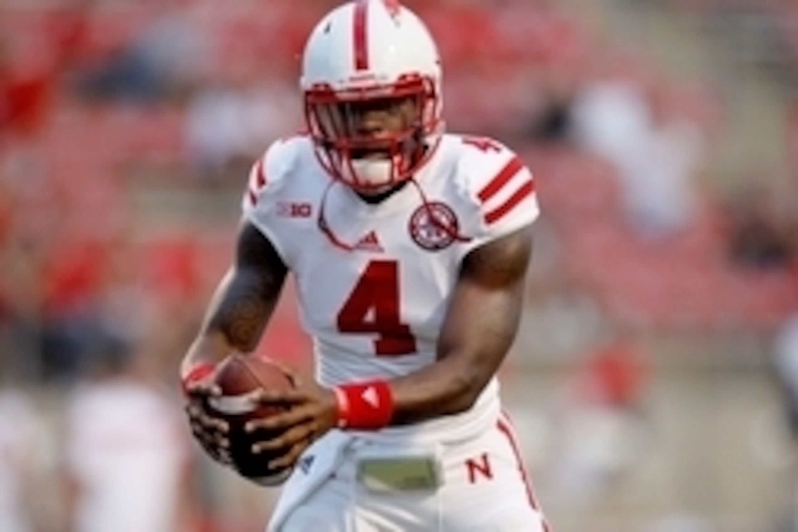Sep 13, 2014; Fresno, CA, USA; Nebraska Cornhuskers quarterback Tommy Armstrong Jr. (4) warms up before the start of the game against the Fresno State Bulldogs at Bulldog Stadium. Mandatory Credit: Cary Edmondson-USA TODAY Sports