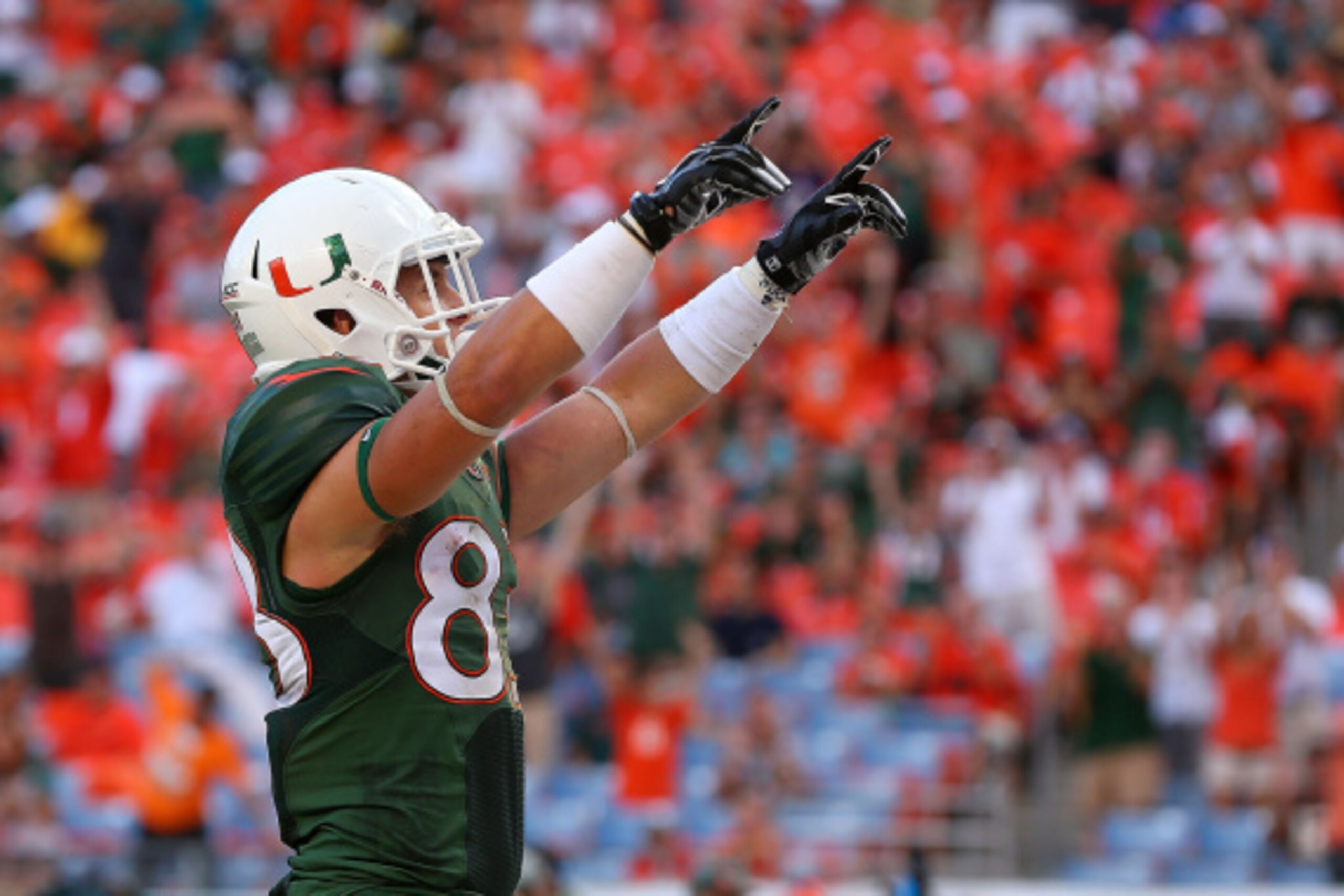 MIAMI, FL - SEPTEMBER 13:  Braxton Berrios #83 of the Miami Hurricanes celebrates a touchdown during a game against the Arkansas State Red Wolves at Sunlife Stadium on September 13, 2014 in Miami, Florida.  (Photo by Mike Ehrmann/Getty Images)