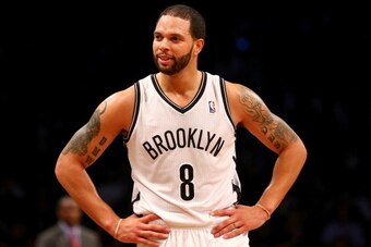 NEW YORK, NY - APRIL 25:  Deron Williams #8 of the Brooklyn Nets reacts in the second half against the Toronto Raptors in Game Three of the Eastern Conference Quarterfinals during the 2014 NBA Playoffs at the Barclays Center on April 25, 2014 in the Brook