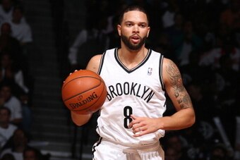BROOKLYN, NY - MAY 10: Deron Williams #8 of the Brooklyn Nets handles the ball against the Miami Heat during Game Three of the Eastern Conference Semifinals on May 10, 2014 at Barclays Center in Brooklyn. NOTE TO USER: User expressly acknowledges and agre